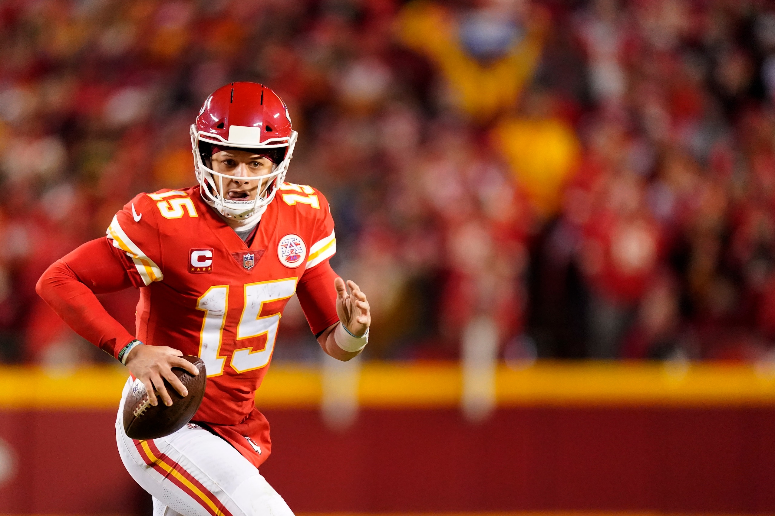 Kansas City Chiefs quarterback Patrick Mahomes looks to pass during the second half of an NFL divisional round playoff football game against the Buffalo Bills, Sunday, Jan. 23, 2022, in Kansas City, Mo. (AP Photo/Charlie Riedel)