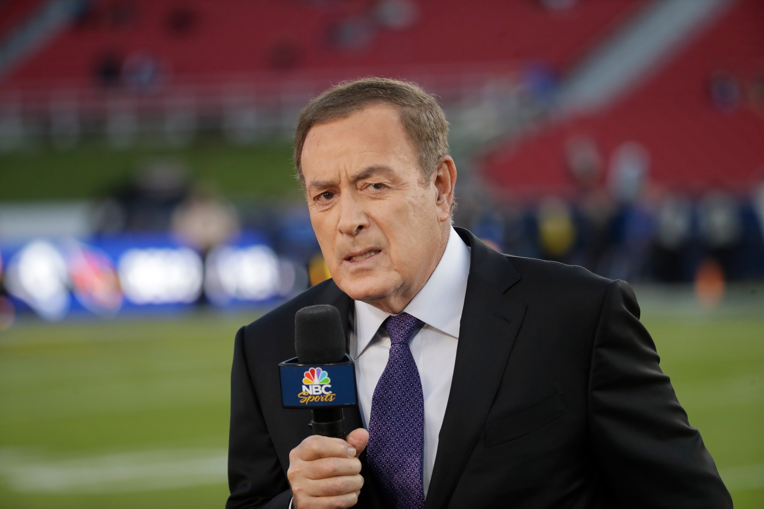 Al Michaels, play-by-play voice for NBC's Sunday Night Football, works on the sideline before an NFL game between the Los Angeles Rams and the Seattle Seahawks, Sunday, Dec. 8, 2019, in Los Angeles. Former ABC baseball commentator Al Michaels has been voted the Ford C. Frick Award for broadcast excellence by baseball’s Hall of Fame. Michaels, 76, will be honored during the Hall of Fame induction weekend in July.(AP Photo/Marcio Jose Sanchez)