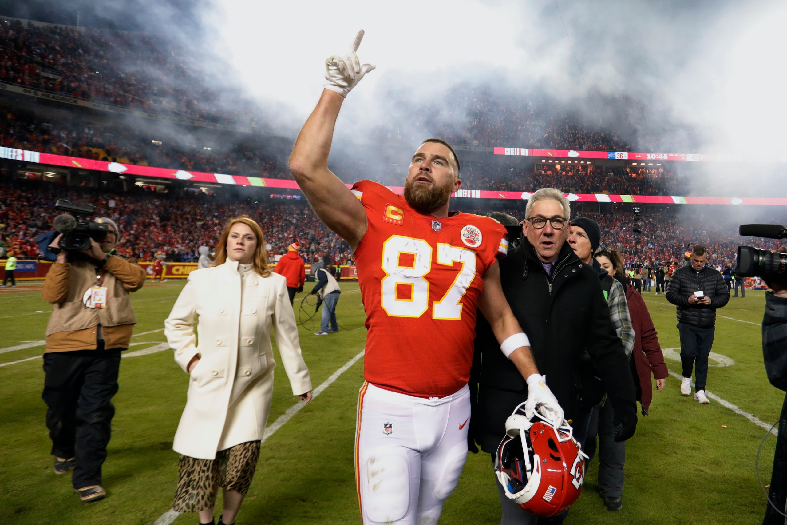 Kansas City Chiefs tight end Travis Kelce (87) walks off the field after an NFL divisional round playoff football game against the Buffalo Bills, Sunday, Jan. 23, 2022, in Kansas City, Mo. The Chiefs won 42-36 in overtime. (AP Photo/Colin E. Braley)