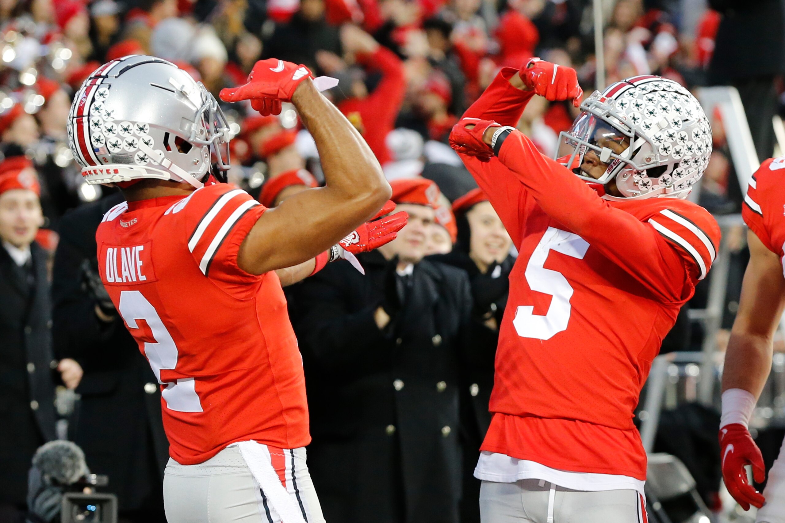 Ohio State receiver Garrett Wilson, right, celebrates his touchdown against Purdue with teammate Chris Olave during the first half of an NCAA college football game, Saturday, Nov. 13, 2021, in Columbus, Ohio. (AP Photo/Jay LaPrete)