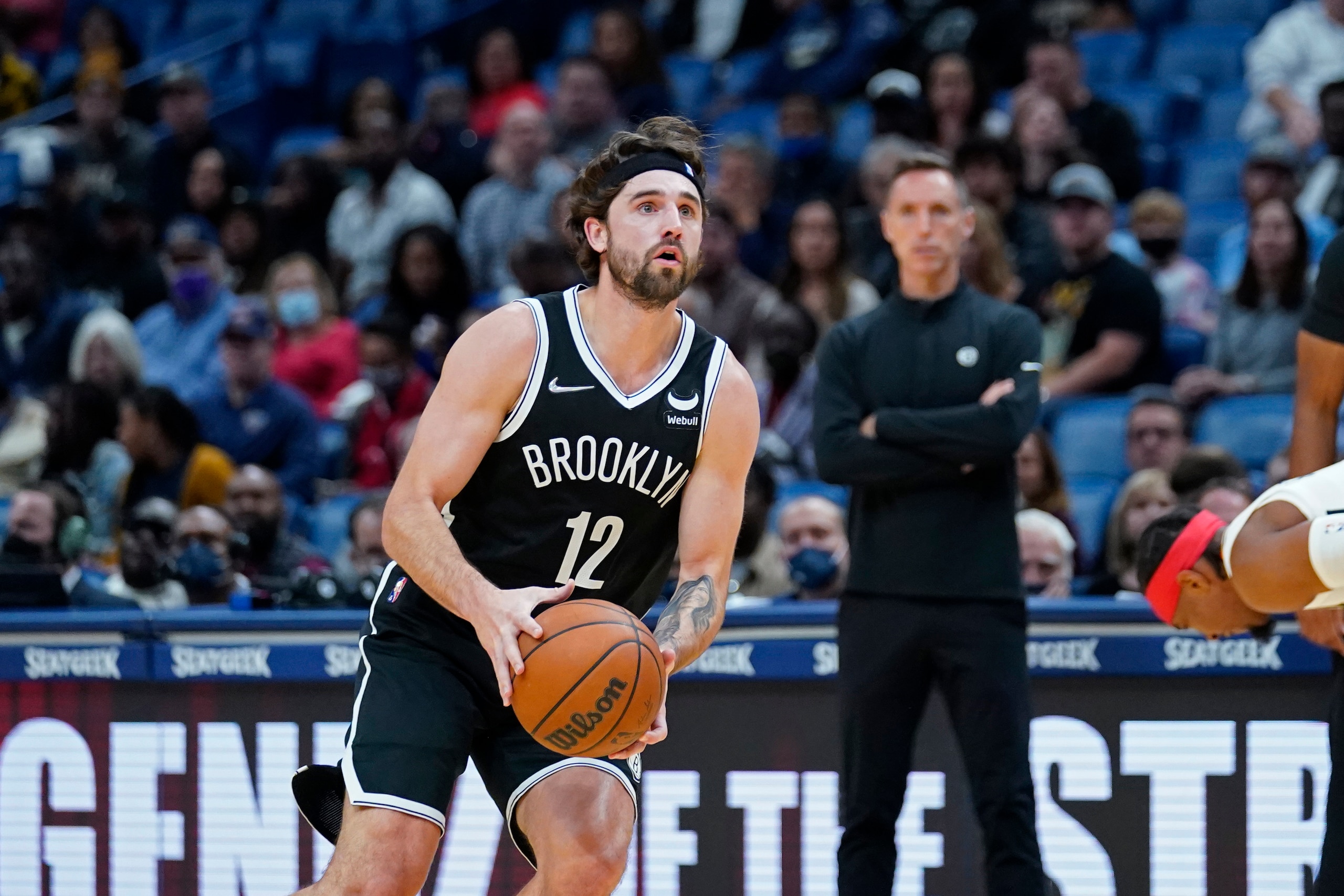 Brooklyn Nets forward Joe Harris (12) shoots in the first half of an NBA basketball game against the New Orleans Pelicans in New Orleans, Friday, Nov. 12, 2021. (AP Photo/Gerald Herbert)