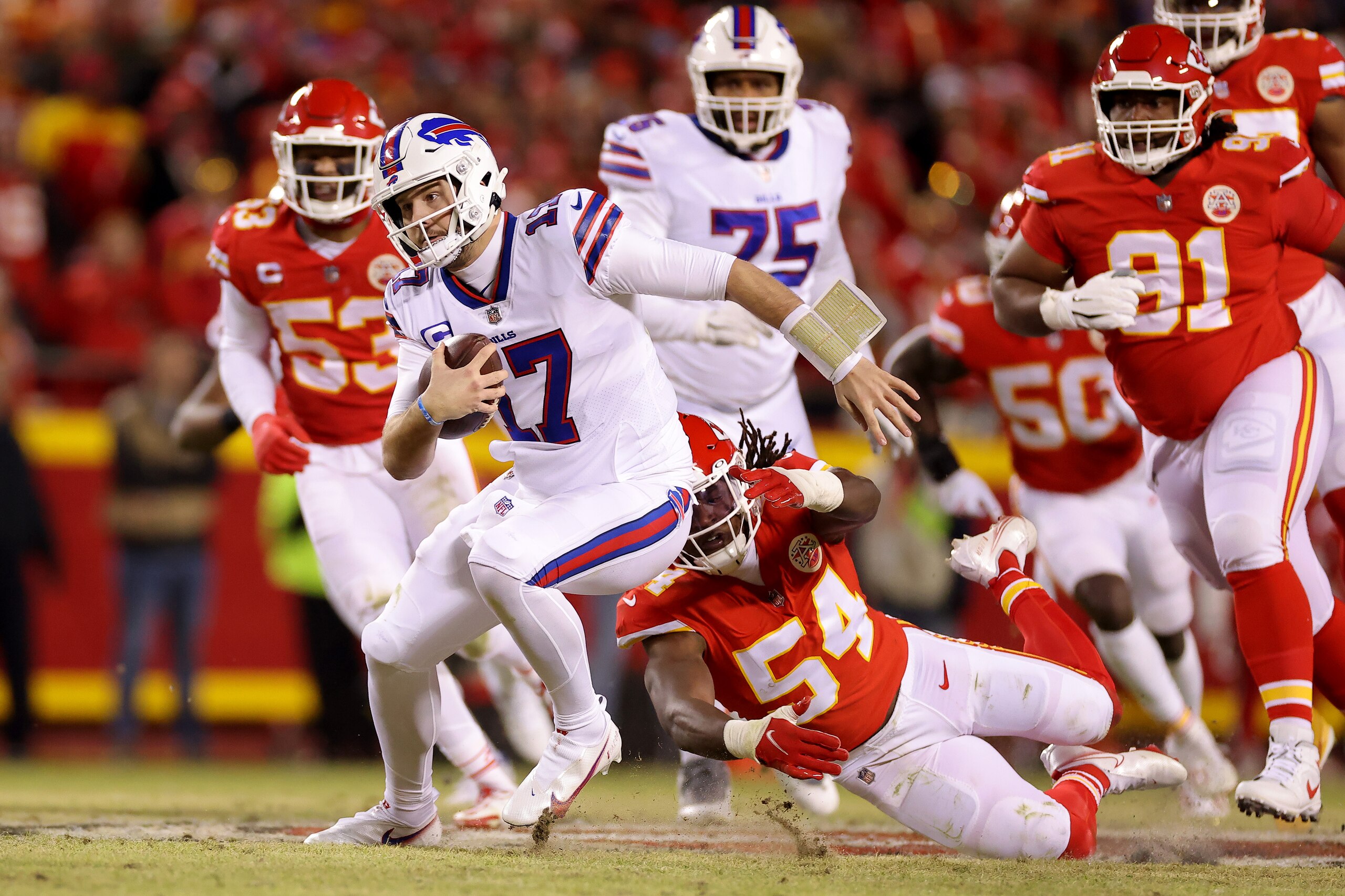 KANSAS CITY, MISSOURI - JANUARY 23: Josh Allen #17 of the Buffalo Bills runs the ball against the Kansas City Chiefs during the second quarter in the AFC Divisional Playoff game at Arrowhead Stadium on January 23, 2022 in Kansas City, Missouri. (Photo by David Eulitt/Getty Images) KANSAS CITY, MISSOURI - JANUARY 23: Josh Allen #17 of the Buffalo Bills runs the ball against the Kansas City Chiefs during the second quarter in the AFC Divisional Playoff game at Arrowhead Stadium on January 23, 2022 in Kansas City, Missouri. (Photo by David Eulitt/Getty Images)