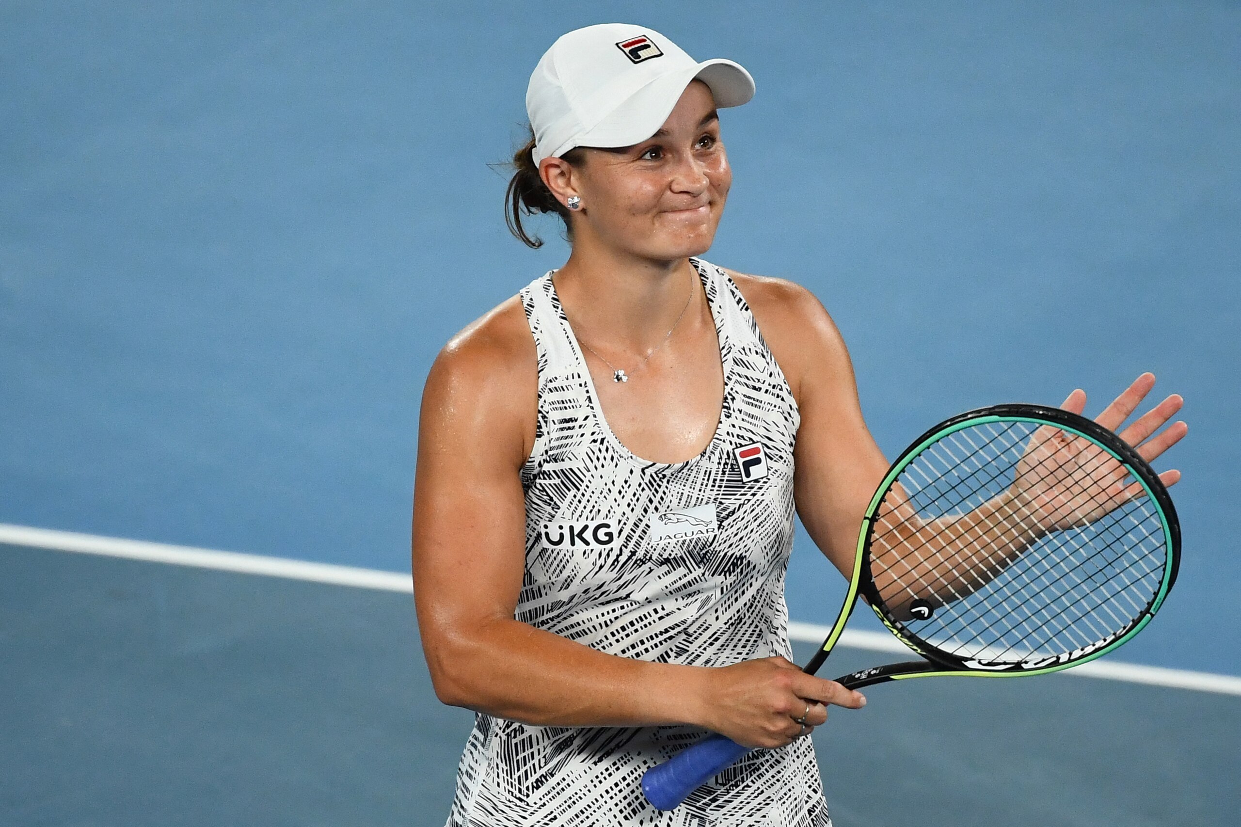 Australia's Ashleigh Barty celebrates after beating Madison Keys of the US in their women's singles semi-final match on day eleven of the Australian Open tennis tournament in Melbourne on January 27, 2022. - -- IMAGE RESTRICTED TO EDITORIAL USE - STRICTLY NO COMMERCIAL USE -- (Photo by William WEST / AFP) / -- IMAGE RESTRICTED TO EDITORIAL USE - STRICTLY NO COMMERCIAL USE -- (Photo by WILLIAM WEST/AFP via Getty Images)