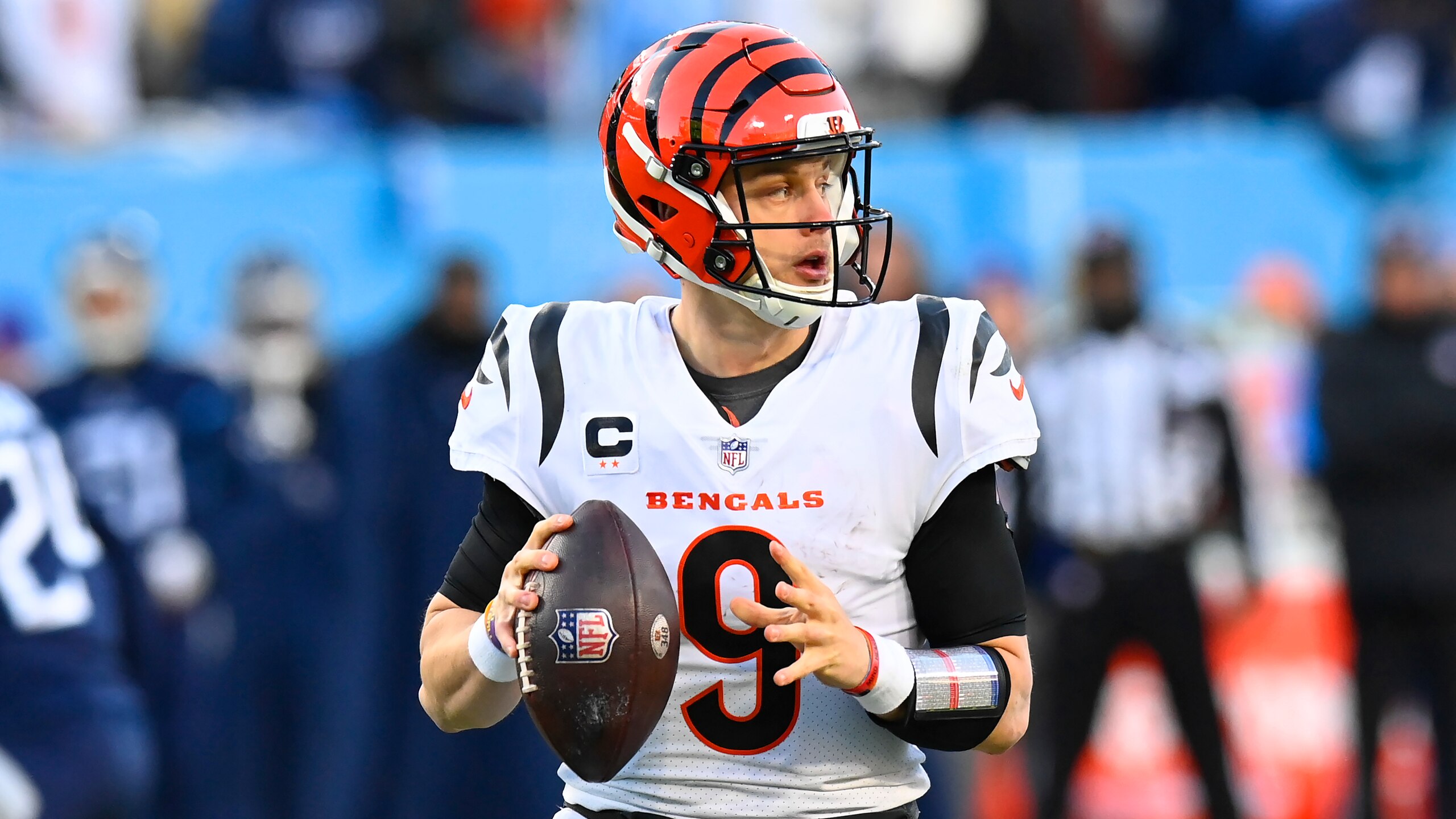 Cincinnati Bengals quarterback Joe Burrow (9) works in the pocket against the Tennessee Titans during the first half of an NFL divisional round playoff football game, Saturday, Jan. 22, 2022, in Nashville, Tenn. (AP Photo/Mark Zaleski)