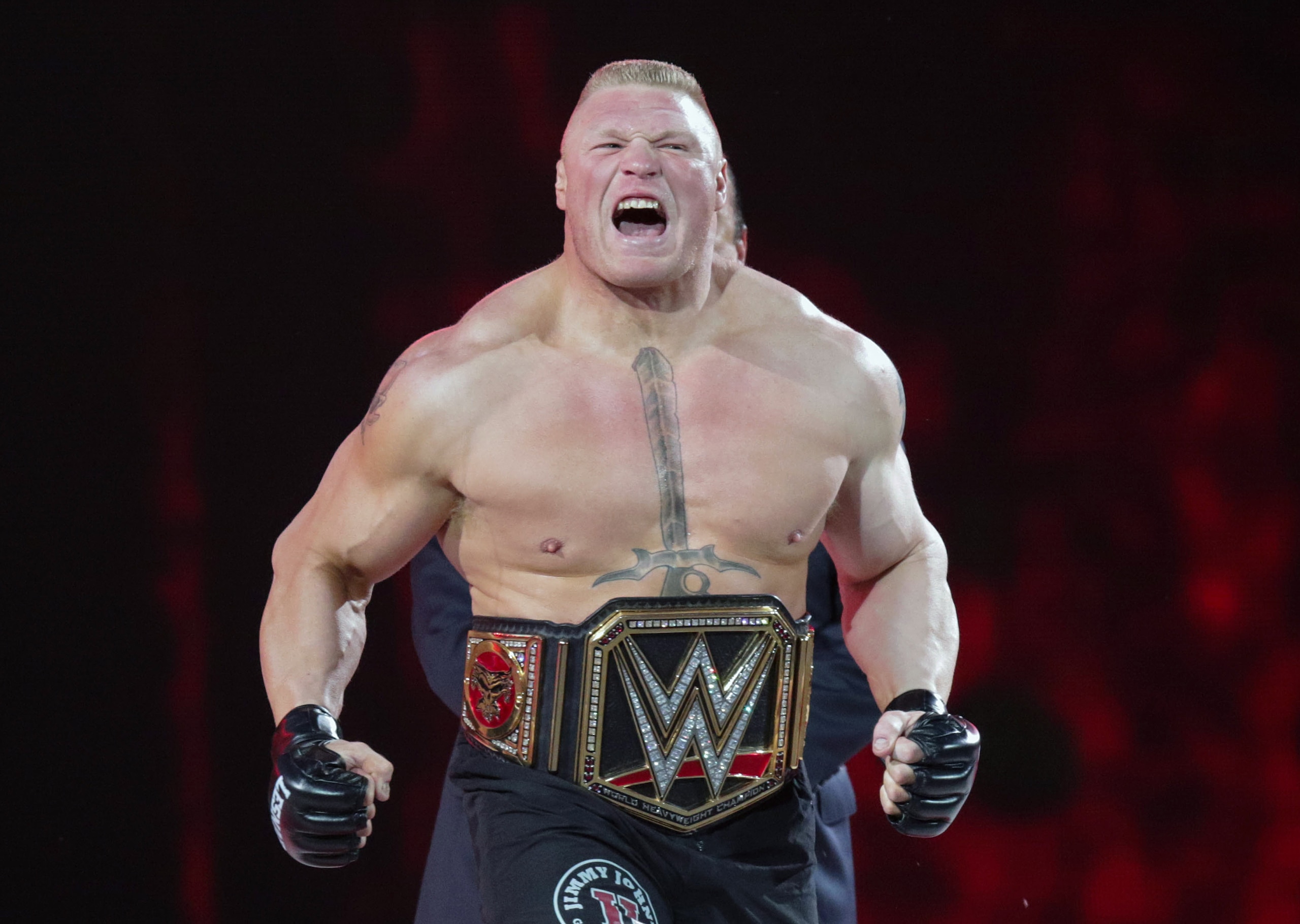 FILE - In this March 29, 2015, file photo, Brock Lesnar makes his entrance at Wrestlemania XXXI in Santa Clara, Calif. UFC 200 has grown so big that a single show can’t contain it. The mixed martial arts promotion is throwing an “International Fight Week” in Las Vegas with compelling shows on three consecutive nights, culminating in the star-studded pay-per-view event Saturday. Jon Jones meets light heavyweight champion Daniel Cormier in the main event of a card also featuring the return of former heavyweight champ Brock Lesnar. (AP Photo/Don Feria, File)