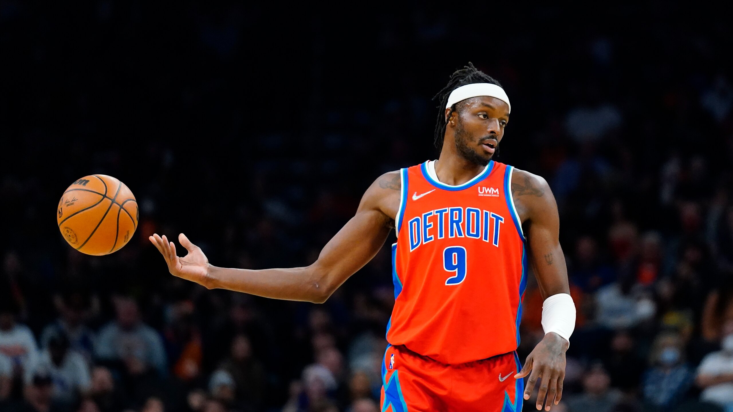 Detroit Pistons forward Jerami Grant passes the ball off to a teammate during the first half of an NBA basketball game against the Phoenix Suns Thursday, Dec. 2, 2021, in Phoenix. (AP Photo/Ross D. Franklin)