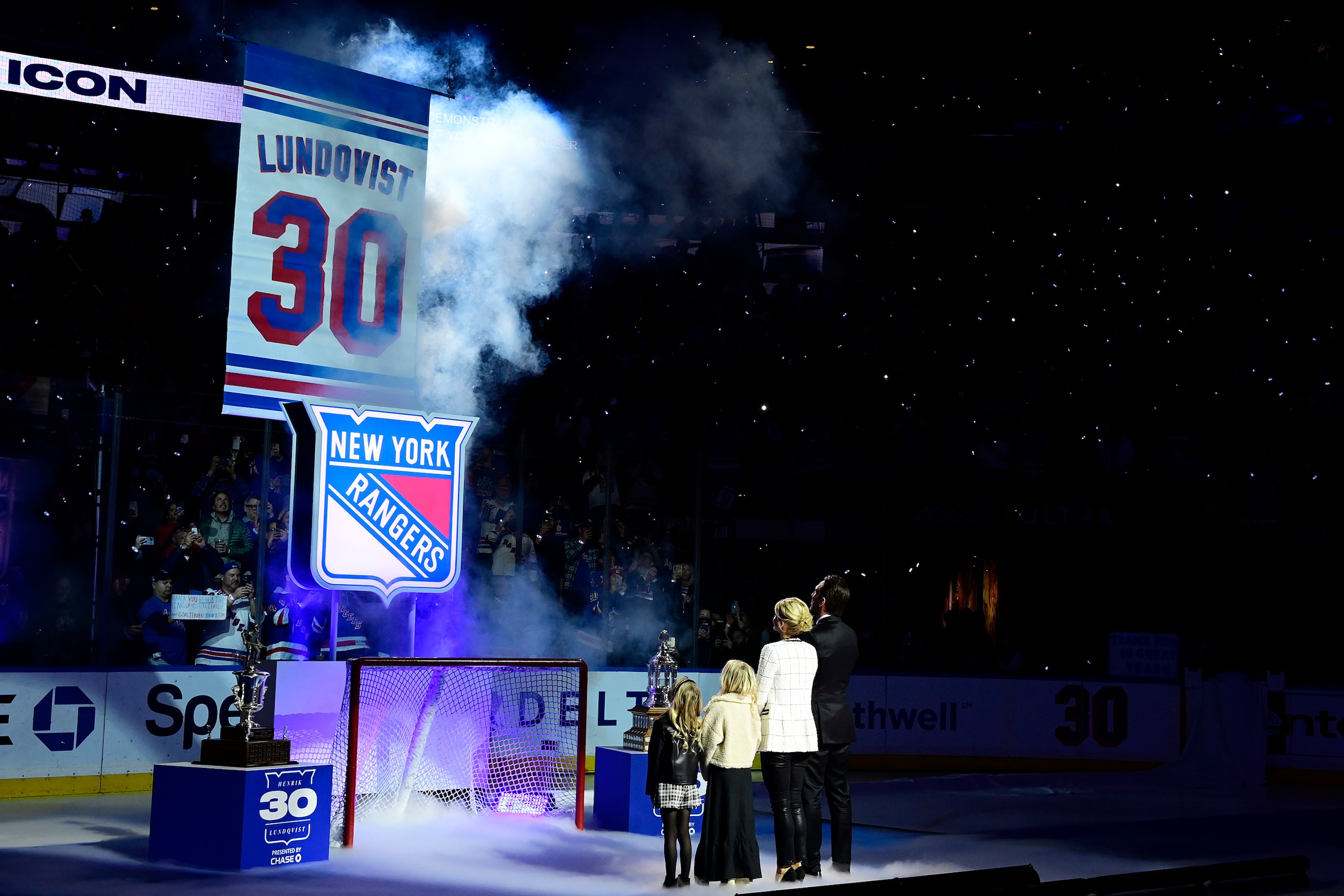 NEW YORK, NEW YORK - JANUARY 28:  Former New York Ranger Henrik Lundqvist and his family watch the #30 banner being raised to the rafters during Lundqvist's jersey retirement ceremony prior to a game between the New York Rangers and Minnesota Wild at Madison Square Garden on January 28, 2022 in New York City. Henrik Lundqvist played all 15 seasons of his NHL career with the Rangers before retiring in 2020. (Photo by Steven Ryan/Getty Images)