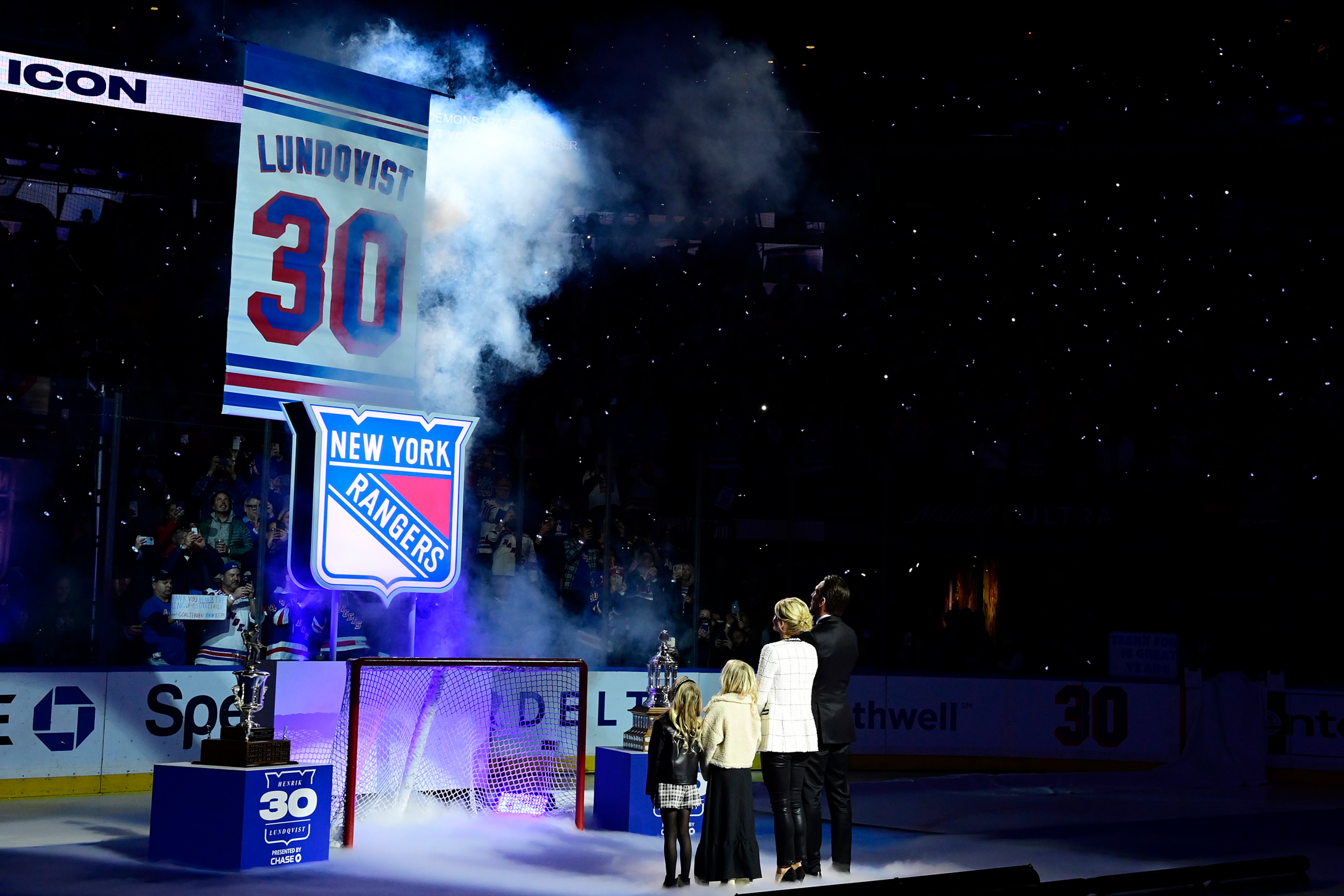 NEW YORK, NEW YORK - JANUARY 28:  Former New York Ranger Henrik Lundqvist and his family watch the #30 banner being raised to the rafters during Lundqvist's jersey retirement ceremony prior to a game between the New York Rangers and Minnesota Wild at Madison Square Garden on January 28, 2022 in New York City. Henrik Lundqvist played all 15 seasons of his NHL career with the Rangers before retiring in 2020. (Photo by Steven Ryan/Getty Images)