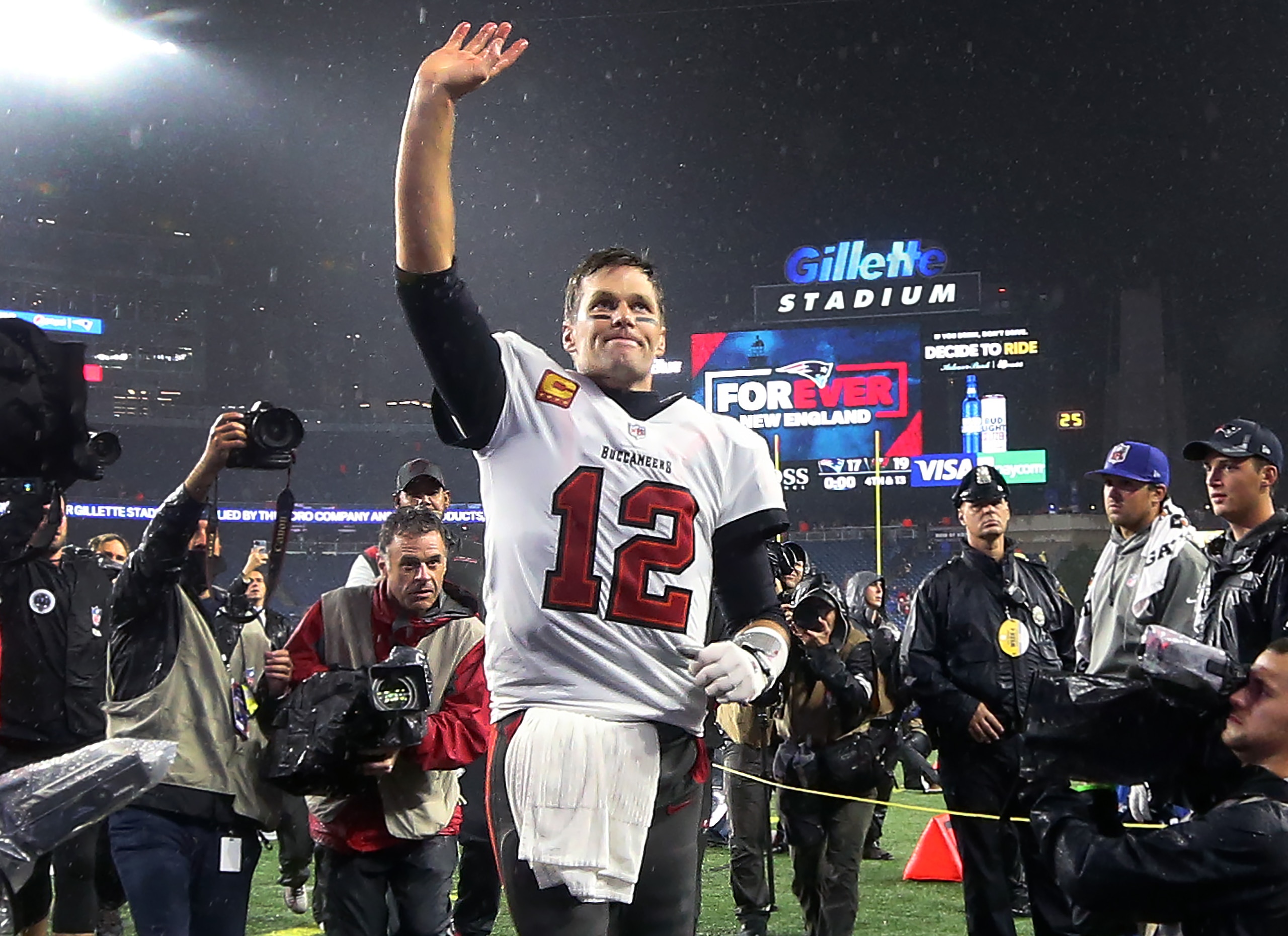 Foxborough, MA - October 3: Tom Brady waves to cheering fans as he leaves the field following the Bucs victory. The New England Patriots host the Tampa Bay Buccaneers in a regular season NFL game at Gillette Stadium in Foxborough, MA on Sunday, Oct. 3, 2021. (Photo by Jim Davis/The Boston Globe via Getty Images)