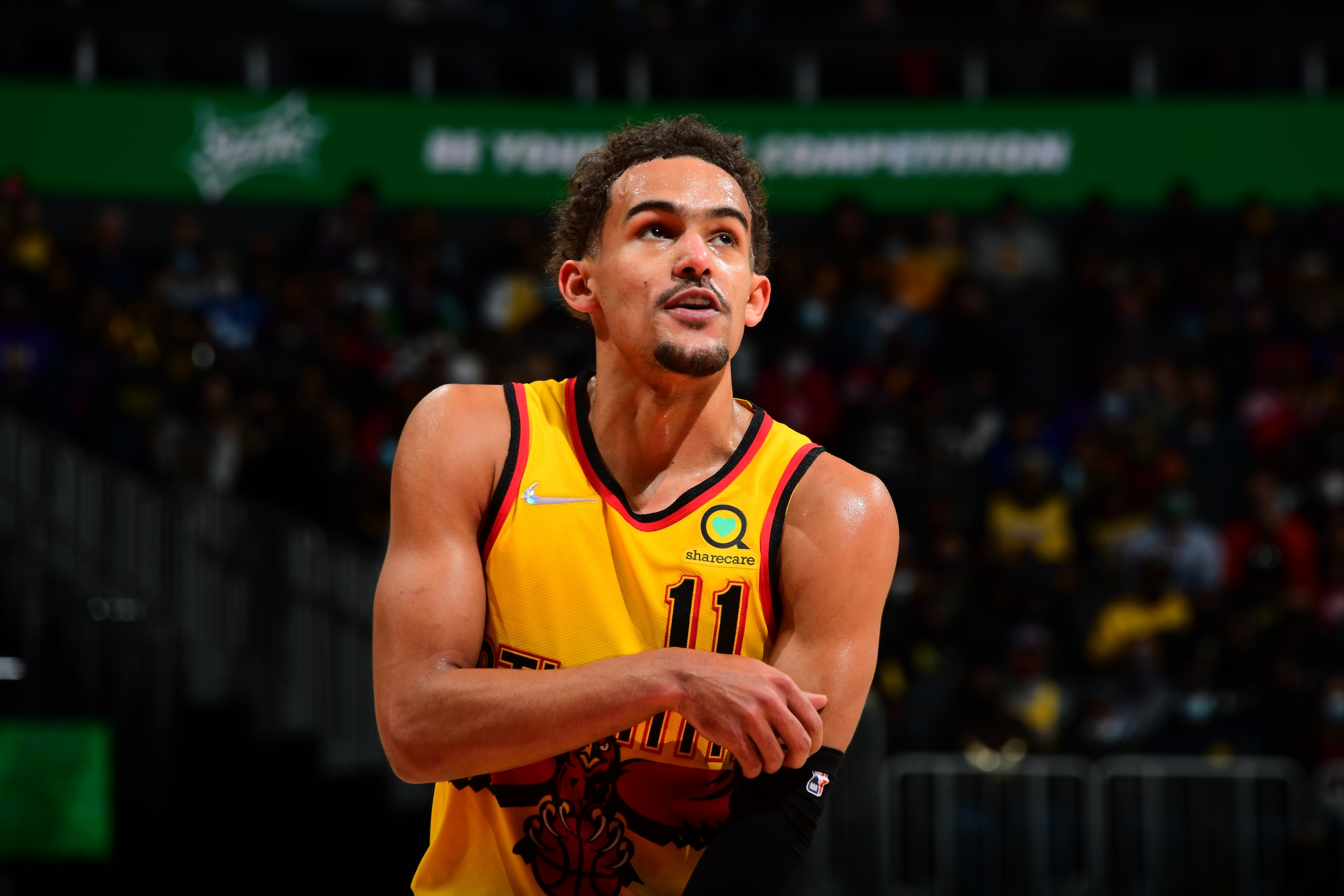 ATLANTA, GA - JANUARY 30: Trae Young #11 of the Atlanta Hawks looks on during the game against the Los Angeles Lakers on January 30, 2022 at State Farm Arena in Atlanta, Georgia.  NOTE TO USER: User expressly acknowledges and agrees that, by downloading and/or using this Photograph, user is consenting to the terms and conditions of the Getty Images License Agreement. Mandatory Copyright Notice: Copyright 2022 NBAE (Photo by Scott Cunningham/NBAE via Getty Images)