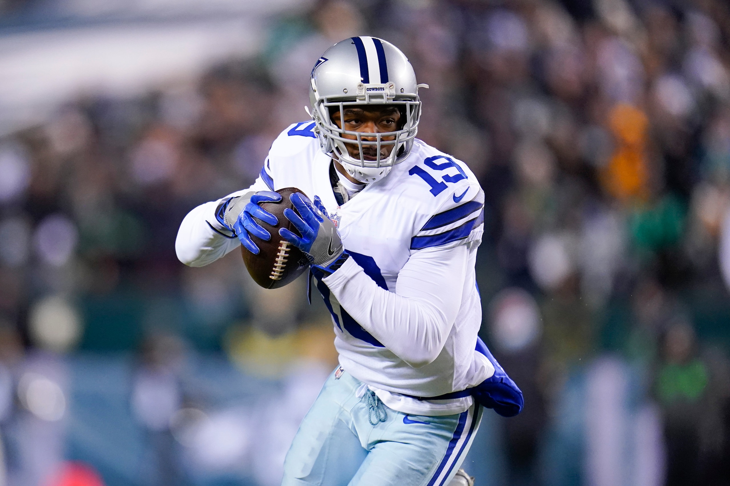 Dallas Cowboys wide receiver Amari Cooper runs with the ball after making a catch against the Philadelphia Eagles during the first half of an NFL football game between the Philadelphia Eagles and the Dallas Cowboys, Monday, Jan. 10, 2022, in Philadelphia. The Cowboys won 51-26. (AP Photo/Julio Cortez) Dallas Cowboys wide receiver Amari Cooper runs with the ball after making a catch against the Philadelphia Eagles during the first half of an NFL football game between the Philadelphia Eagles and the Dallas Cowboys, Monday, Jan. 10, 2022, in Philadelphia. The Cowboys won 51-26. (AP Photo/Julio Cortez)
