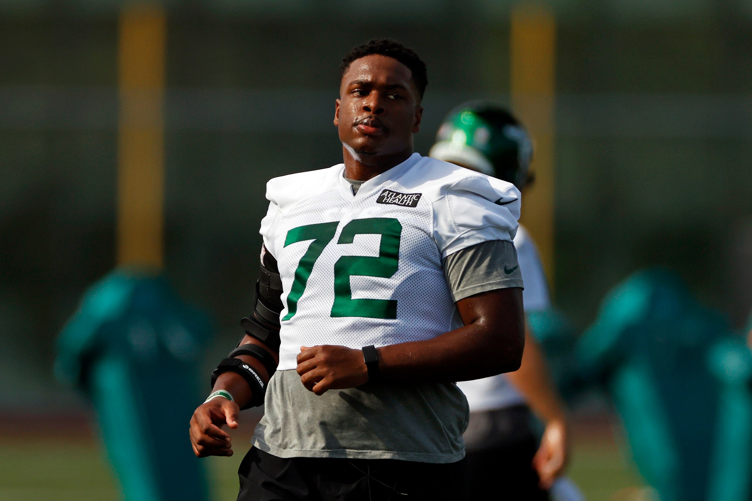 New York Jets offensive tackle Cameron Clark (72) during a practice at the NFL football team's training camp in Florham Park, N.J., Saturday, Aug. 22, 2020. (AP Photo/Adam Hunger)