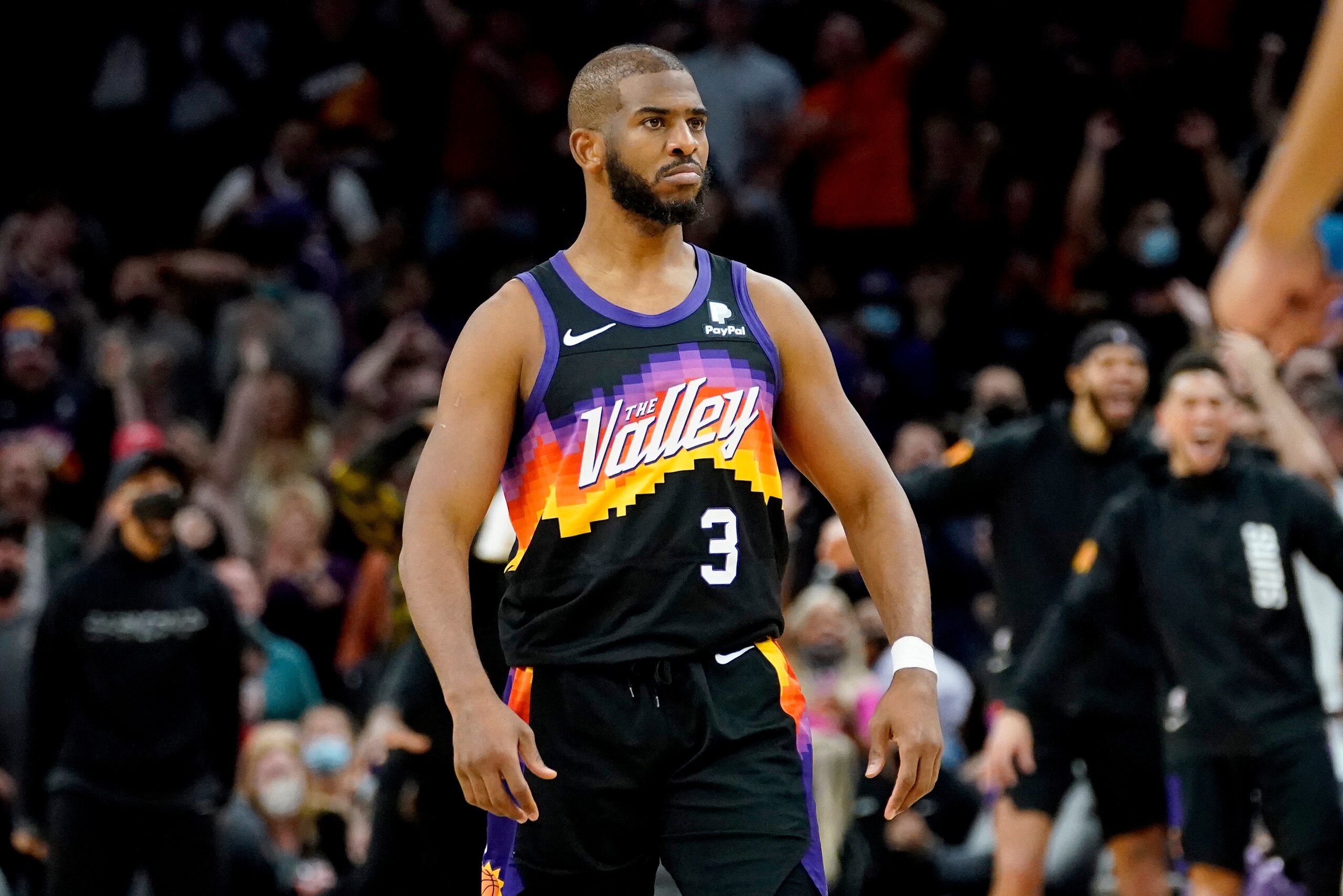 Phoenix Suns guard Chris Paul (3) stares towards the San Antonio Spurs bench after scoring during the second half of an NBA basketball game, Sunday, Jan. 30, 2022, in Phoenix. The Suns defeated the Spurs 115-110. (AP Photo/Matt York)
