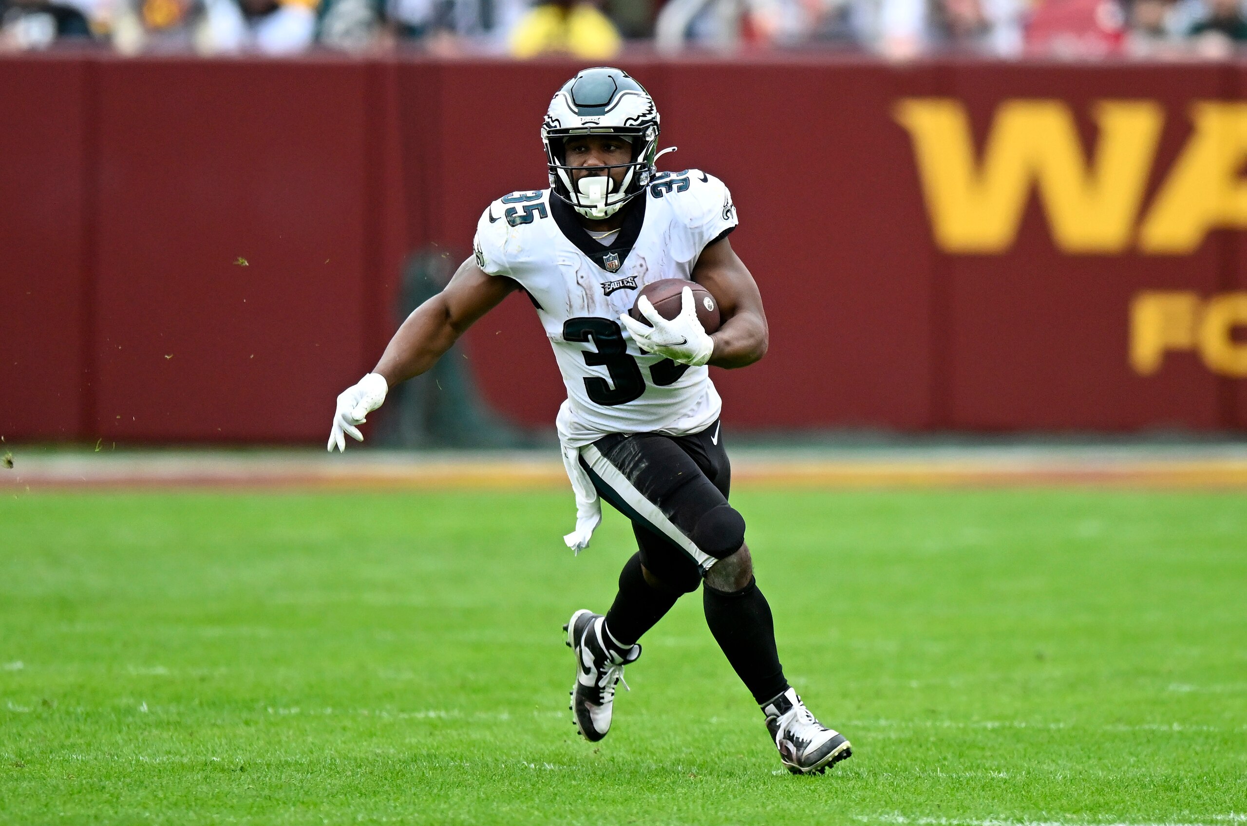 LANDOVER, MARYLAND - JANUARY 02: Boston Scott #35 of the Philadelphia Eagles rushes the ball against the Washington Football Team at FedExField on January 02, 2022 in Landover, Maryland. (Photo by G Fiume/Getty Images)