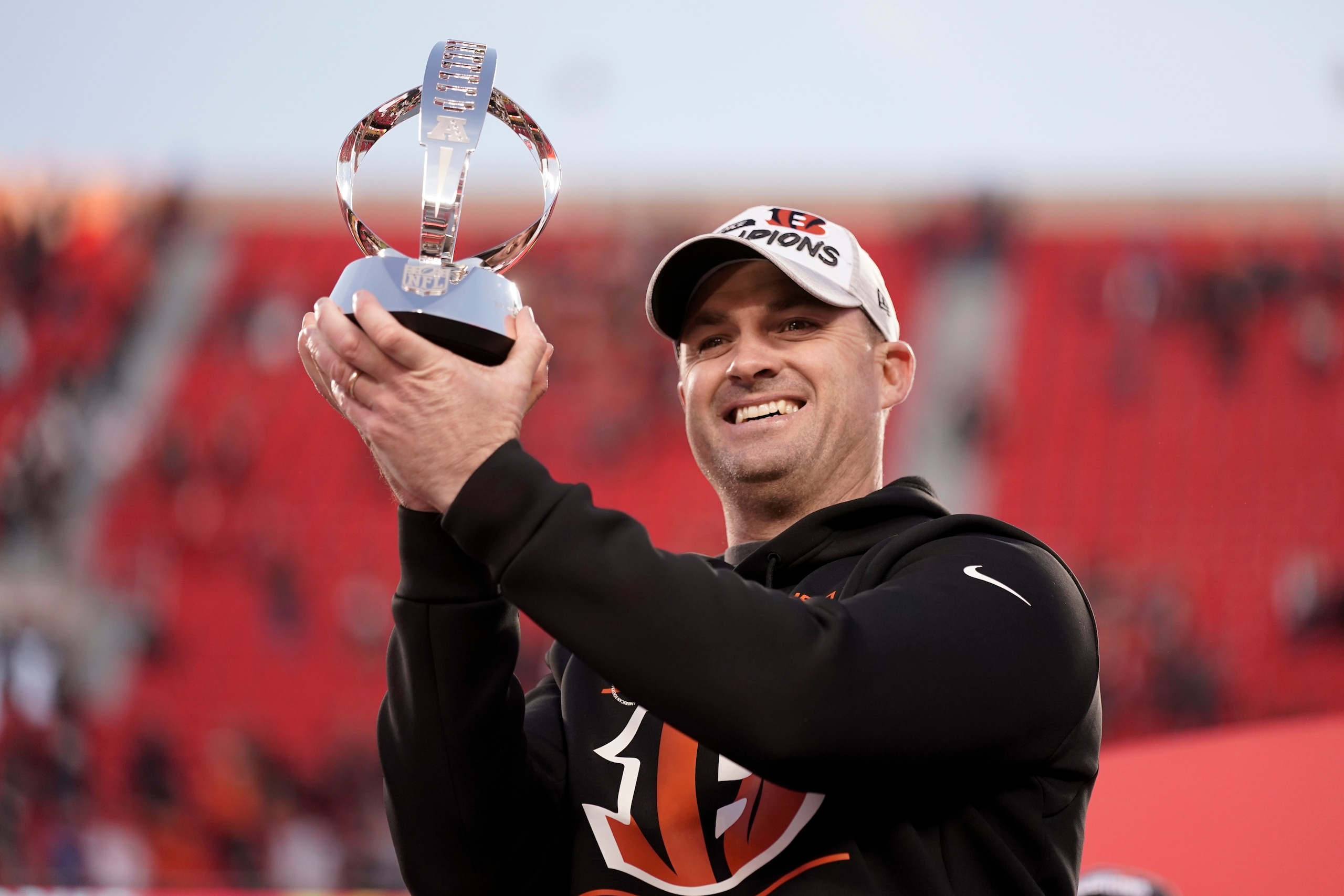 Cincinnati Bengals head coach Zac Taylor holds the Lamar Hunt trophy after the AFC championship NFL football game against the Kansas City Chiefs, Sunday, Jan. 30, 2022, in Kansas City, Mo. The Bengals won 27-24 in overtime. (AP Photo/Charlie Riedel)