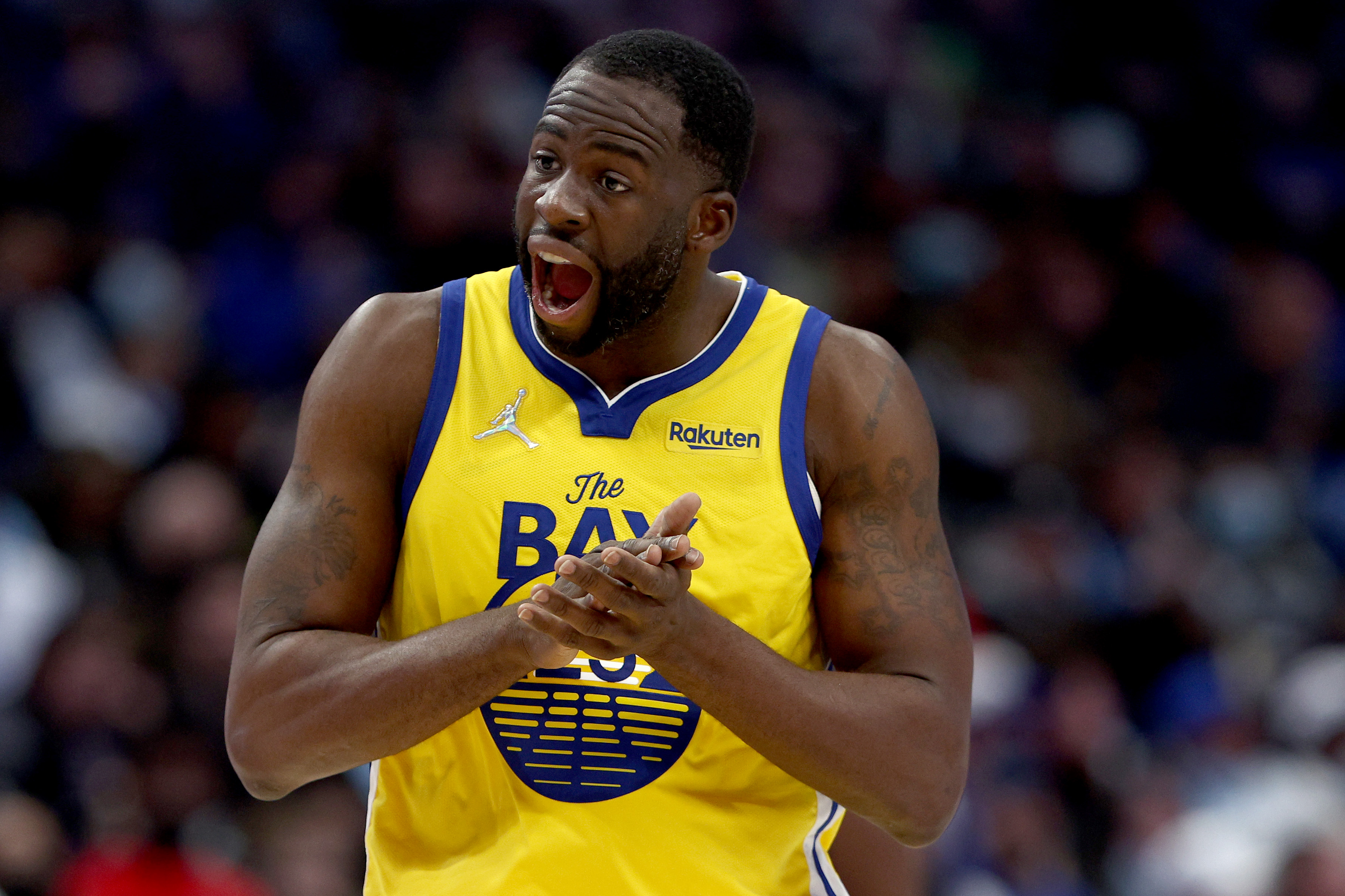 DALLAS, TEXAS - JANUARY 05: Draymond Green #23 of the Golden State Warriors reacts after being fouled by the Dallas Mavericks in the third quarter at American Airlines Center on January 05, 2022 in Dallas, Texas.  NOTE TO USER: User expressly acknowledges and agrees that, by downloading and or using this photograph, User is consenting to the terms and conditions of the Getty Images License Agreement. (Photo by Tom Pennington/Getty Images)