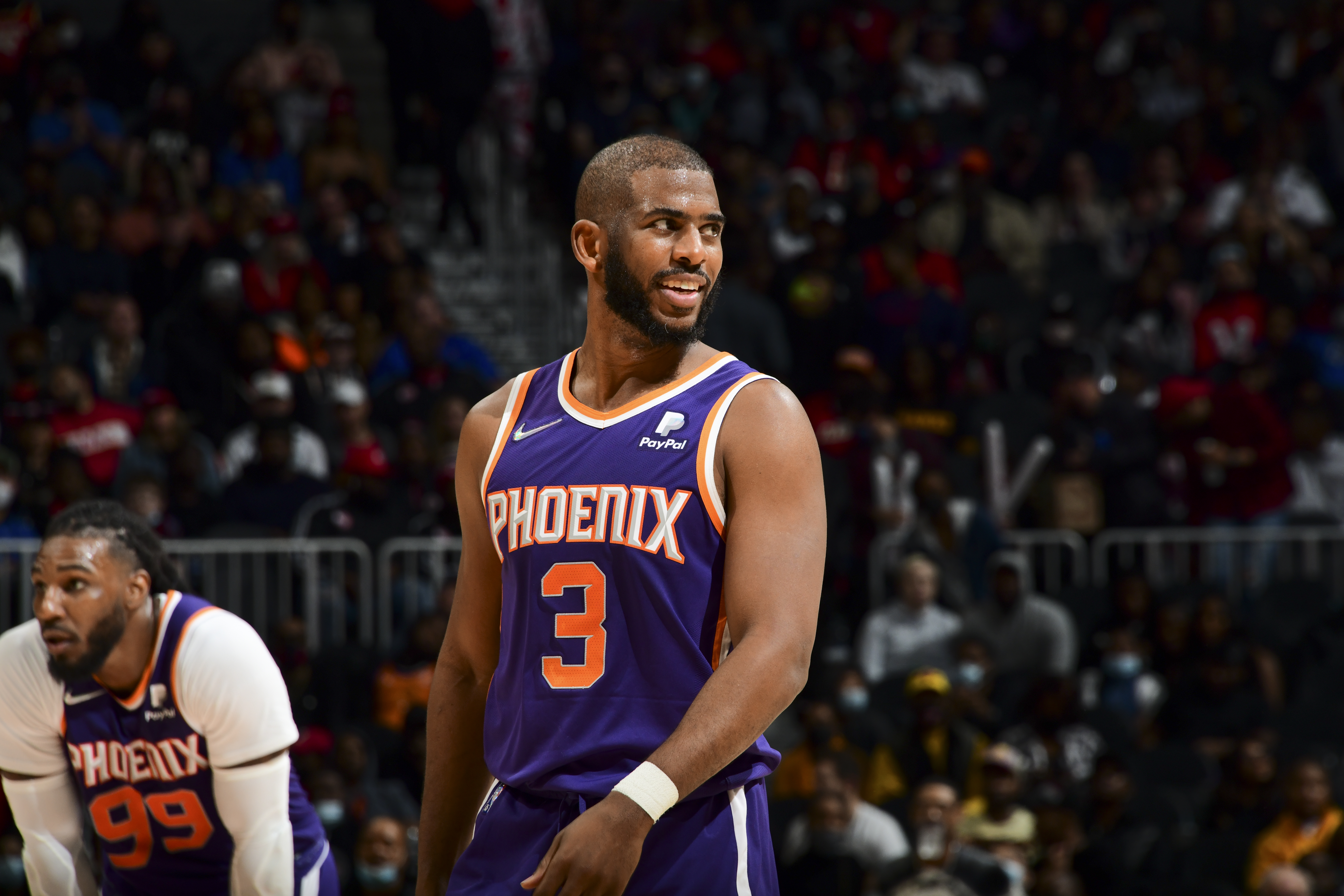 ATLANTA, GA - FEBRUARY 3: Chris Paul #3 of the Phoenix Suns smiles during the game against the Atlanta Hawks on February 3, 2022 at State Farm Arena in Atlanta, Georgia.  NOTE TO USER: User expressly acknowledges and agrees that, by downloading and/or using this Photograph, user is consenting to the terms and conditions of the Getty Images License Agreement. Mandatory Copyright Notice: Copyright 2022 NBAE (Photo by Scott Cunningham/NBAE via Getty Images)