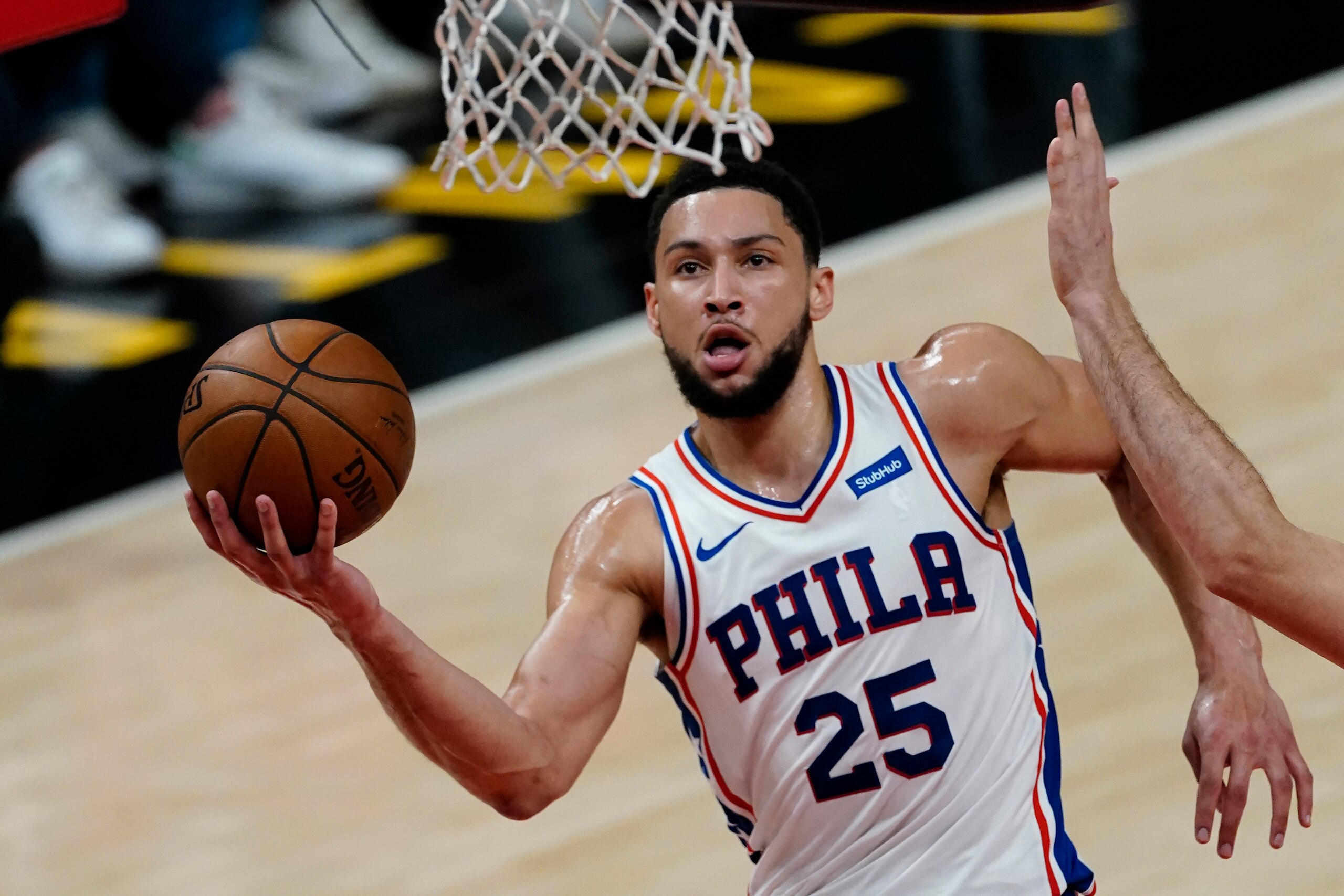 FILE - Philadelphia 76ers guard Ben Simmons (25) goes to the basket during their NBA playoff basketball game against the Atlanta Hawks, in Atlanta, in this Saturday, June 12, 2021, file photo. Ben Simmons can't shoot and lost his confidence. He blamed a mental block on the worst free-throw shooting percentage in NBA playoff history. The 76ers head into the offseason faced with a big question - do they try and salvage Simmons or deal the former No. 1 pick. (AP Photo/John Bazemore, File)
