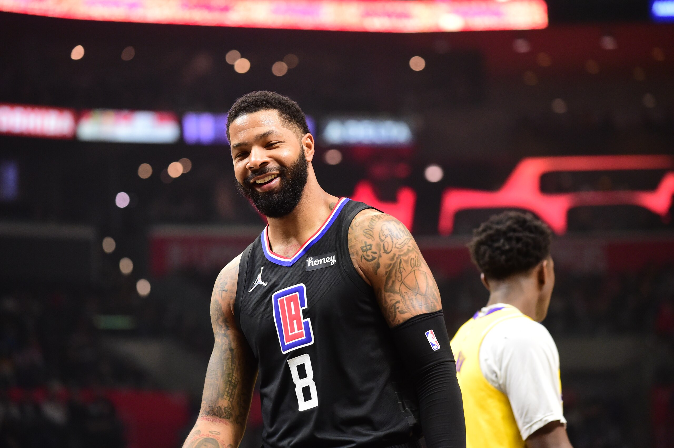 LOS ANGELES, CA - FEBRUARY 3: Marcus Morris Sr. #8 of the LA Clippers smiles during the game against the Los Angeles Lakers on February 3, 2022 at Crypto.Com Arena in Los Angeles, California. NOTE TO USER: User expressly acknowledges and agrees that, by downloading and/or using this Photograph, user is consenting to the terms and conditions of the Getty Images License Agreement. Mandatory Copyright Notice: Copyright 2022 NBAE (Photo by Adam Pantozzi/NBAE via Getty Images)