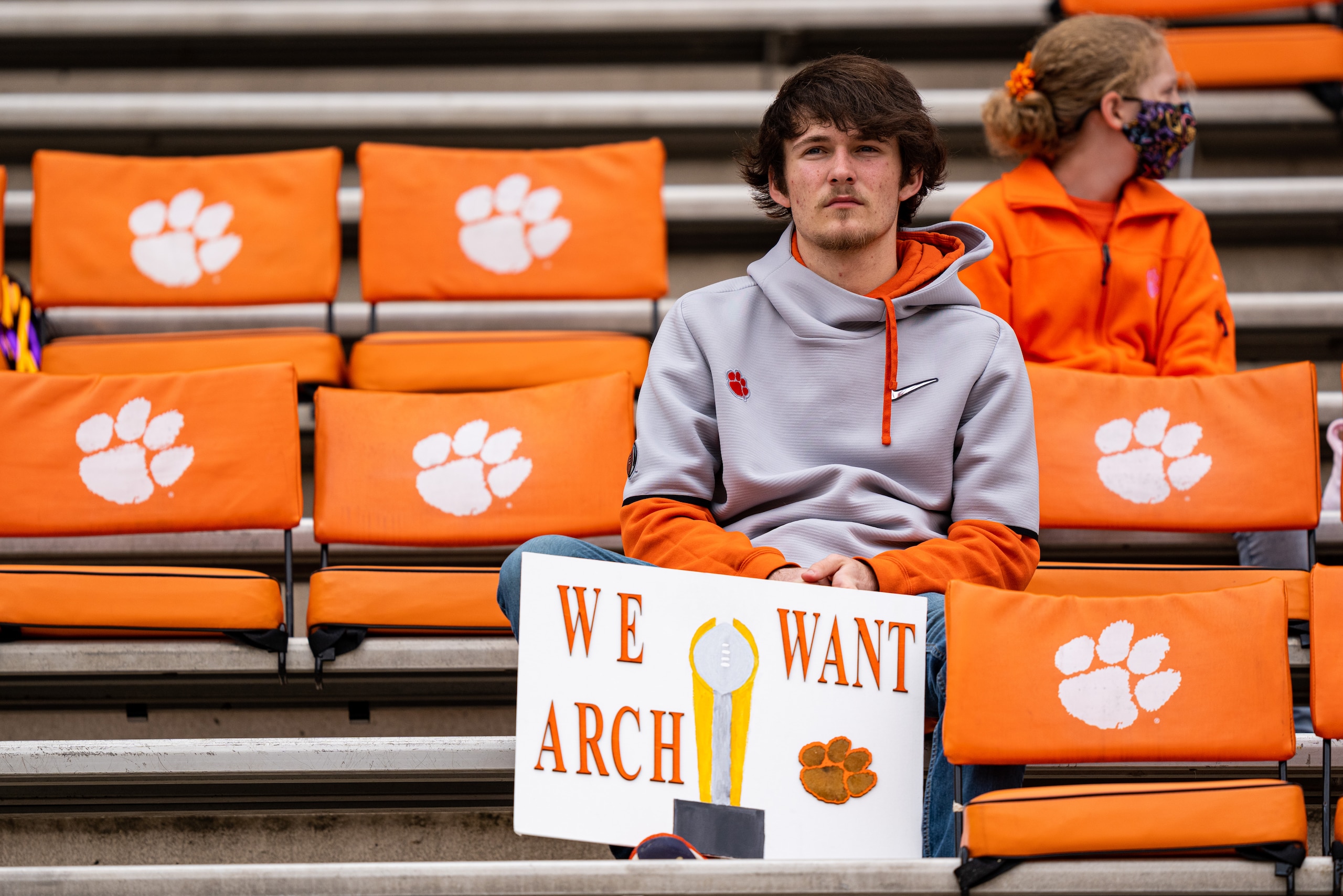 CLEMSON, SOUTH CAROLINA - OCTOBER 30: A fan holds a sign referencing high school recruit Arch Manning before the game between the Clemson Tigers and the Florida State Seminoles at Clemson Memorial Stadium on October 30, 2021 in Clemson, South Carolina. (Photo by Jacob Kupferman/Getty Images) CLEMSON, SOUTH CAROLINA - OCTOBER 30: A fan holds a sign referencing high school recruit Arch Manning before the game between the Clemson Tigers and the Florida State Seminoles at Clemson Memorial Stadium on October 30, 2021 in Clemson, South Carolina. (Photo by Jacob Kupferman/Getty Images)
