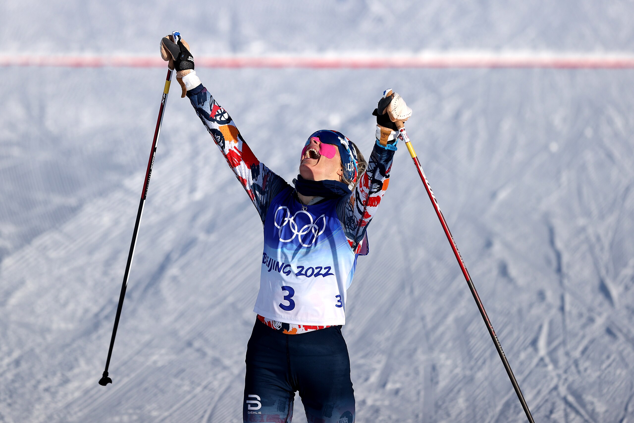 ZHANGJIAKOU, CHINA - FEBRUARY 05: Therese Johaug of Team Norway celebrates crossing the finish line to win the gold medal during the Women's Cross Country 7.5km + 7.5km Skiathlon on Day 1 of the Beijing 2022 Winter Olympic Games at The National Cross-Country Skiing Centre on February 05, 2022 in Zhangjiakou, China. (Photo by Maddie Meyer/Getty Images)