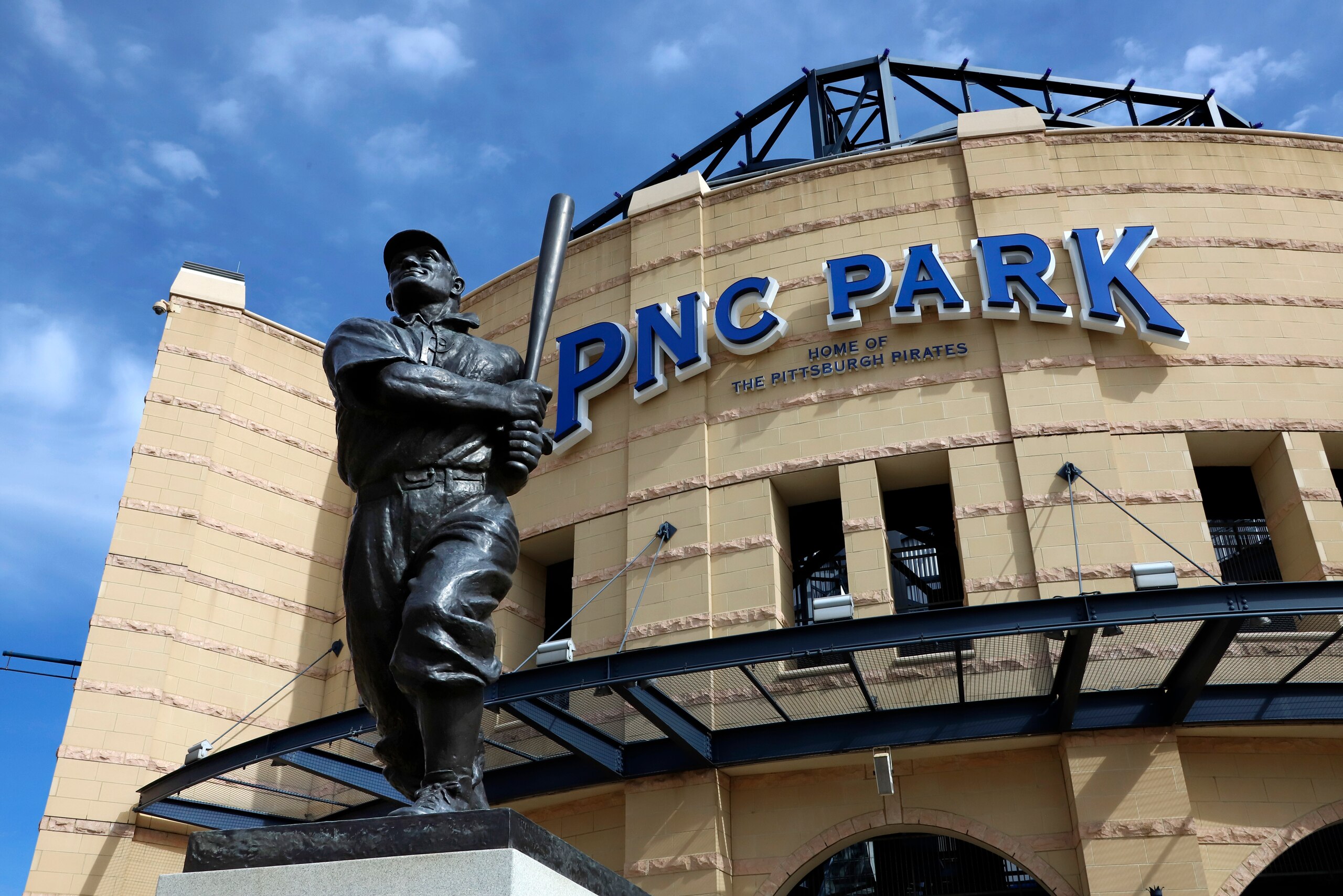 A statue of Pittsburgh Pirates Hall of Fame shortstop Honus Wagner stands in front of PNC Park, the home of the Pittsburgh Pirates on the Northside of Pittsburgh, Thursday, March 26, 2020. The Pirates were to have opened their season on March 26, 2020 in Tampa, against the Tampa Rays. (AP Photo/Gene J. Puskar)