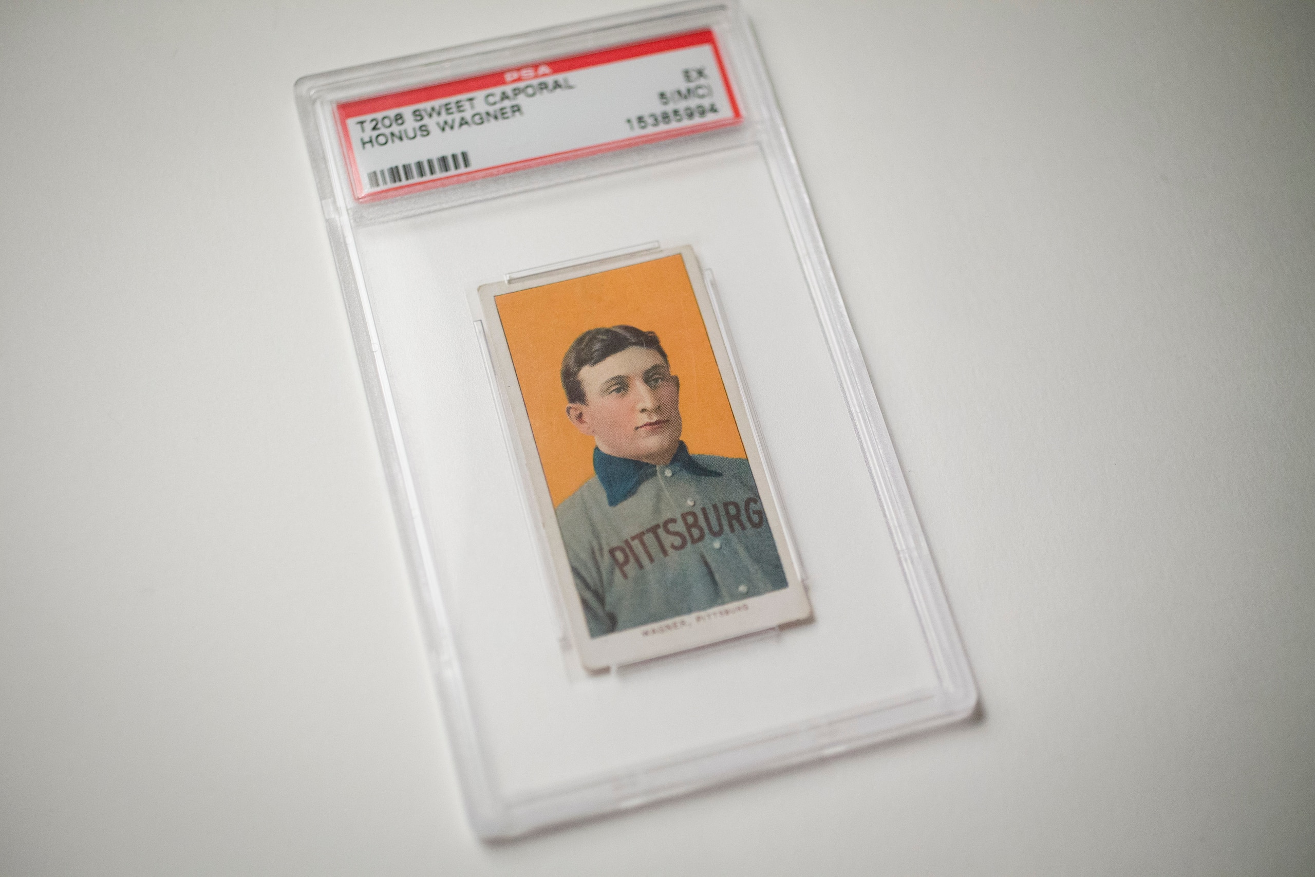 The 1909 baseball card of Pittsburgh Pirates shortstop Honus Wagner is displayed for a photograph in New York, U.S., on Tuesday, Feb. 19, 2013. The trading card that the National Baseball Hall of Fame calls the sport's "most famous collectible" will be up for sale starting Feb. 25,  and might fetch more than $2.8 million, according to the auction house. Photographer: Scott Eells/Bloomberg via Getty Images