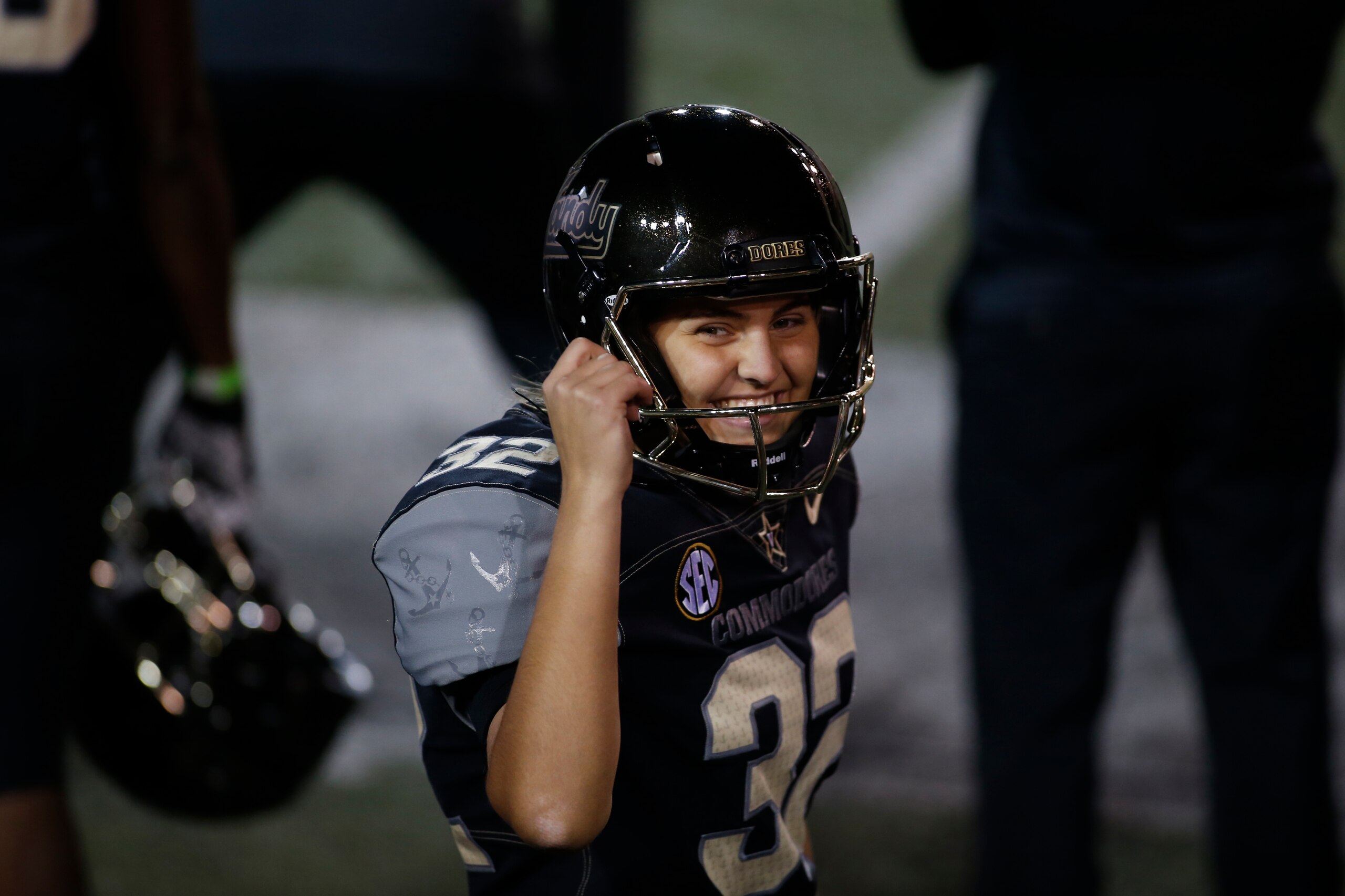 NASHVILLE, TN - DECEMBER 12: Vanderbilt Commodores place kicker Sarah Fuller (32) smiles to cheers for her in the stands after successfully kicking her second point after attempt during a game between the Vanderbilt Commodores and Tennessee Volunteers in which she became the first female to score a point for a power five conference school, December 12, 2020 at Vanderbilt Stadium in Nashville, Tennessee. (Photo by Matthew Maxey/Icon Sportswire via Getty Images)