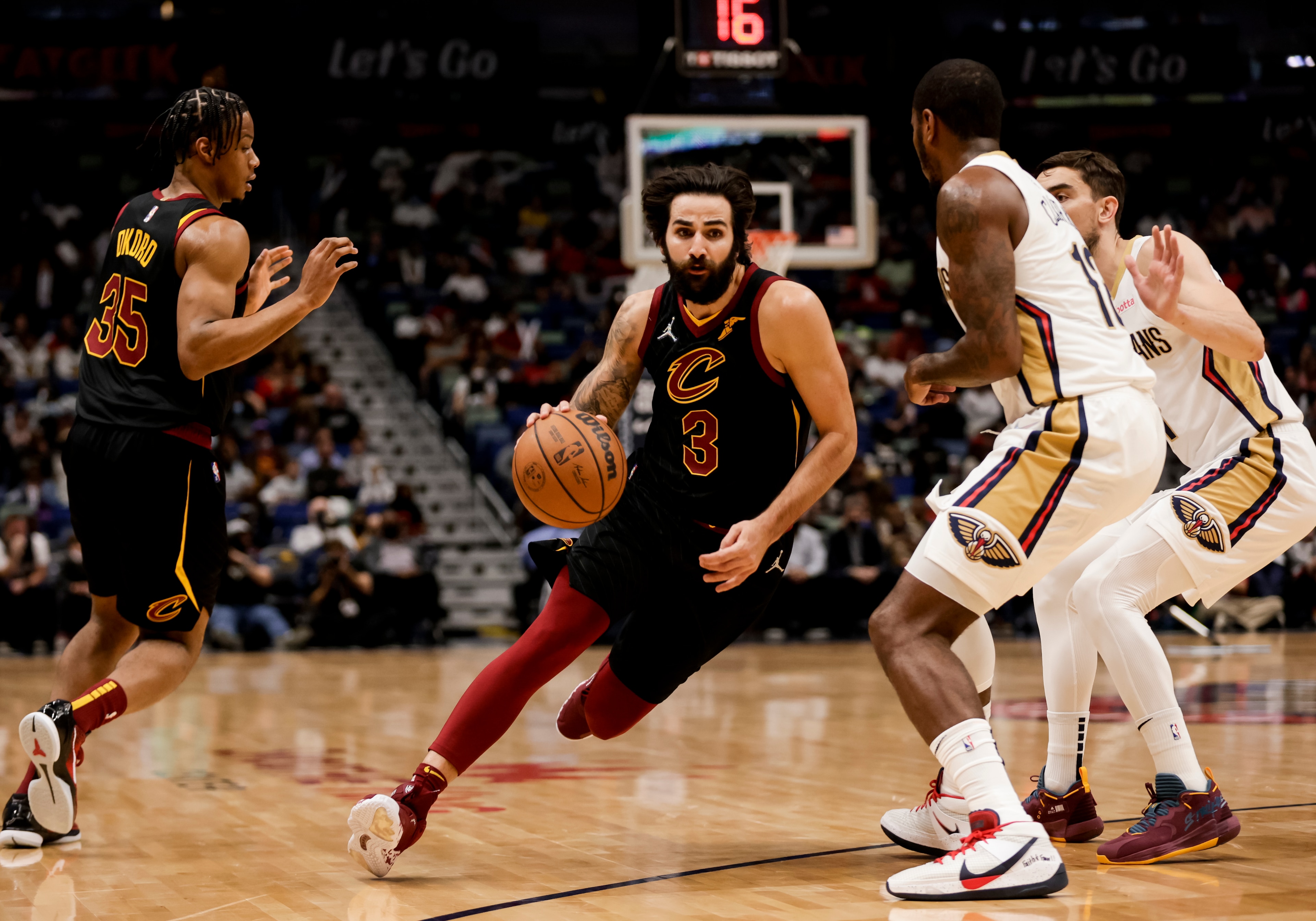 Cleveland Cavaliers guard Ricky Rubio (3) drives past New Orleans Pelicans forward Gary Clark (12) in the first quarter of an NBA basketball game in New Orleans, Tuesday, Dec. 28, 2021. (AP Photo/Derick Hingle) Cleveland Cavaliers guard Ricky Rubio (3) drives past New Orleans Pelicans forward Gary Clark (12) in the first quarter of an NBA basketball game in New Orleans, Tuesday, Dec. 28, 2021. (AP Photo/Derick Hingle)