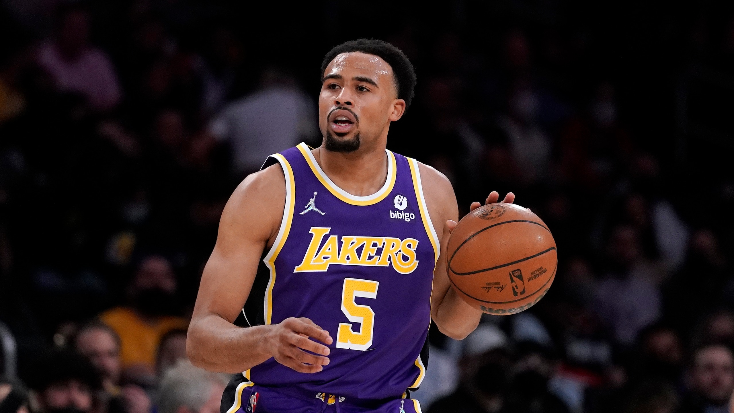 Los Angeles Lakers guard Talen Horton-Tucker dribbles during the first half of an NBA basketball game against the Portland Trail Blazers Wednesday, Feb. 2, 2022, in Los Angeles. (AP Photo/Mark J. Terrill)