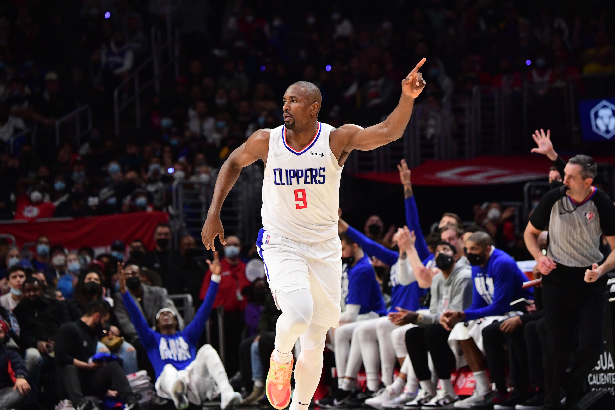 LOS ANGELES, CA - FEBRUARY 6: Serge Ibaka #9 of the LA Clippers celebrates during the game against the Milwaukee Bucks on February 6, 2022 at Crypto.Com Arena in Los Angeles, California. NOTE TO USER: User expressly acknowledges and agrees that, by downloading and/or using this Photograph, user is consenting to the terms and conditions of the Getty Images License Agreement. Mandatory Copyright Notice: Copyright 2022 NBAE (Photo by Adam Pantozzi/NBAE via Getty Images)