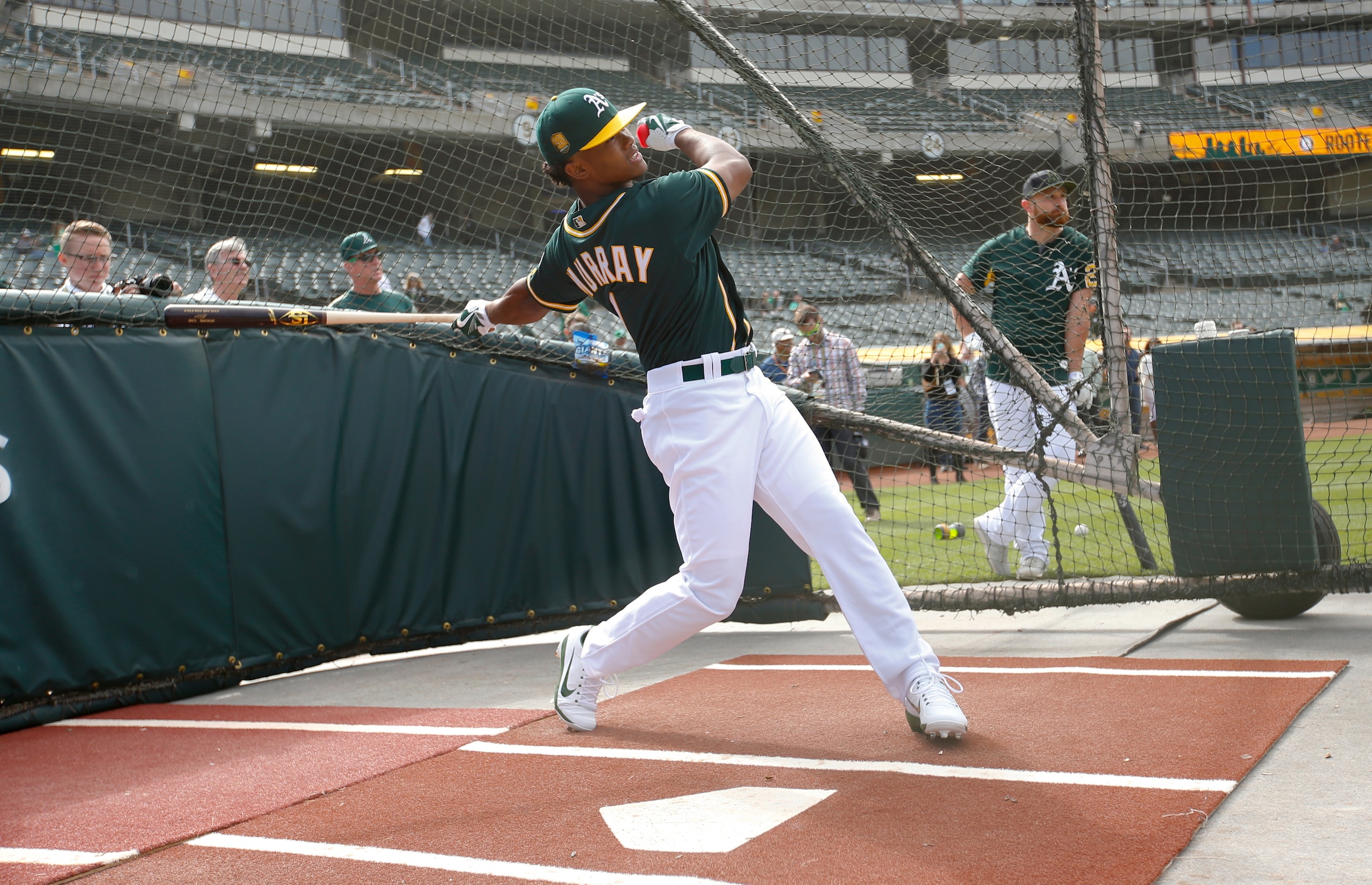 OAKLAND, CA - JUNE 15: First round draft pick Kyler Murray of the Oakland Athletics takes batting practice after signing his contract at the Oakland Alameda Coliseum on June 15, 2018 in Oakland, California. (Photo by Michael Zagaris/Oakland Athletics/Getty Images)