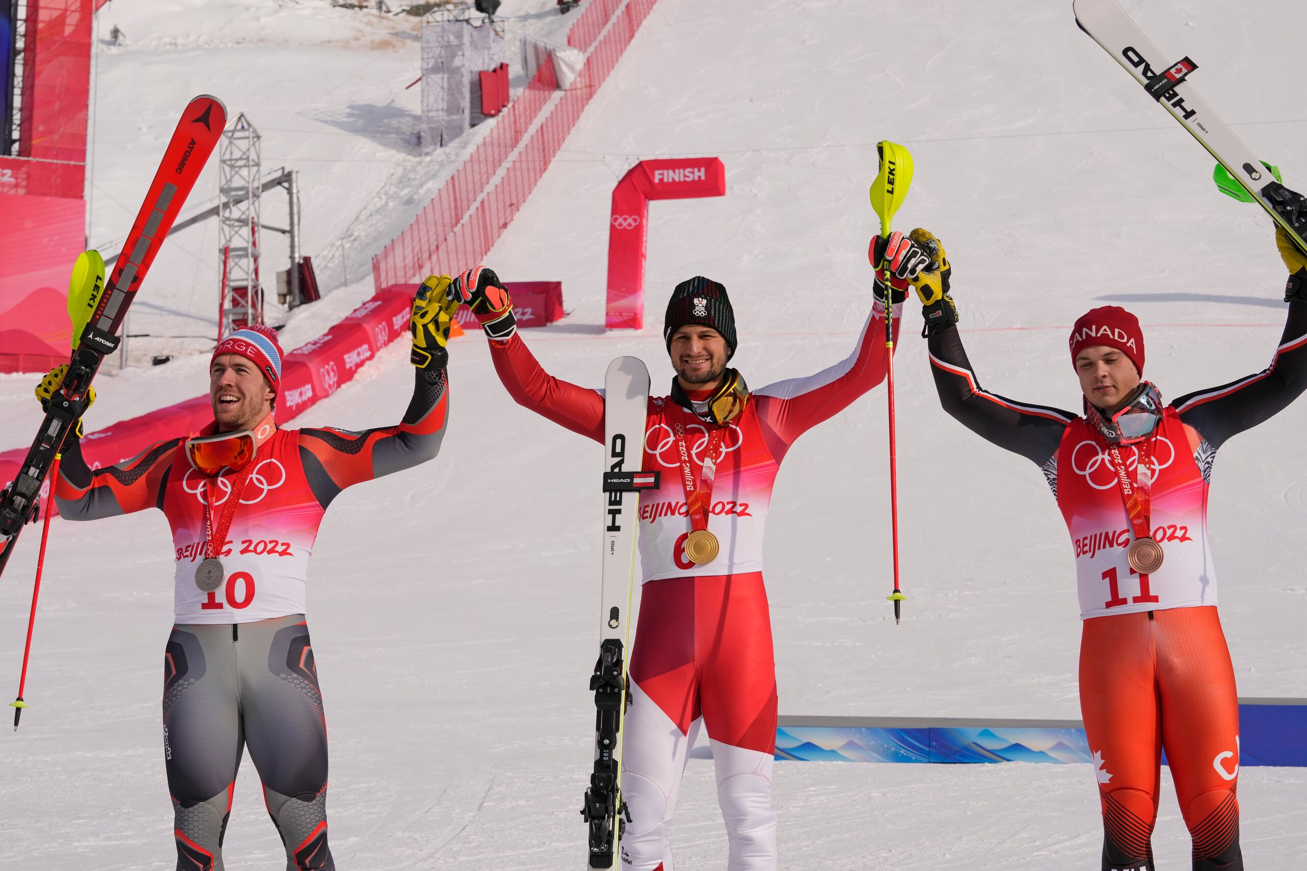From left: Aleksander Aamodt Kilde, of Norway, silver, Johannes Strolz, of Austria, gold, and James Crawford, of Canada, bronze, celebrate during the medal ceremony for the the men's combined at the 2022 Winter Olympics, Thursday, Feb. 10, 2022, in the Yanqing district of Beijing. (AP Photo/Luca Bruno) From left: Aleksander Aamodt Kilde, of Norway, silver, Johannes Strolz, of Austria, gold, and James Crawford, of Canada, bronze, celebrate during the medal ceremony for the the men's combined at the 2022 Winter Olympics, Thursday, Feb. 10, 2022, in the Yanqing district of Beijing. (AP Photo/Luca Bruno)