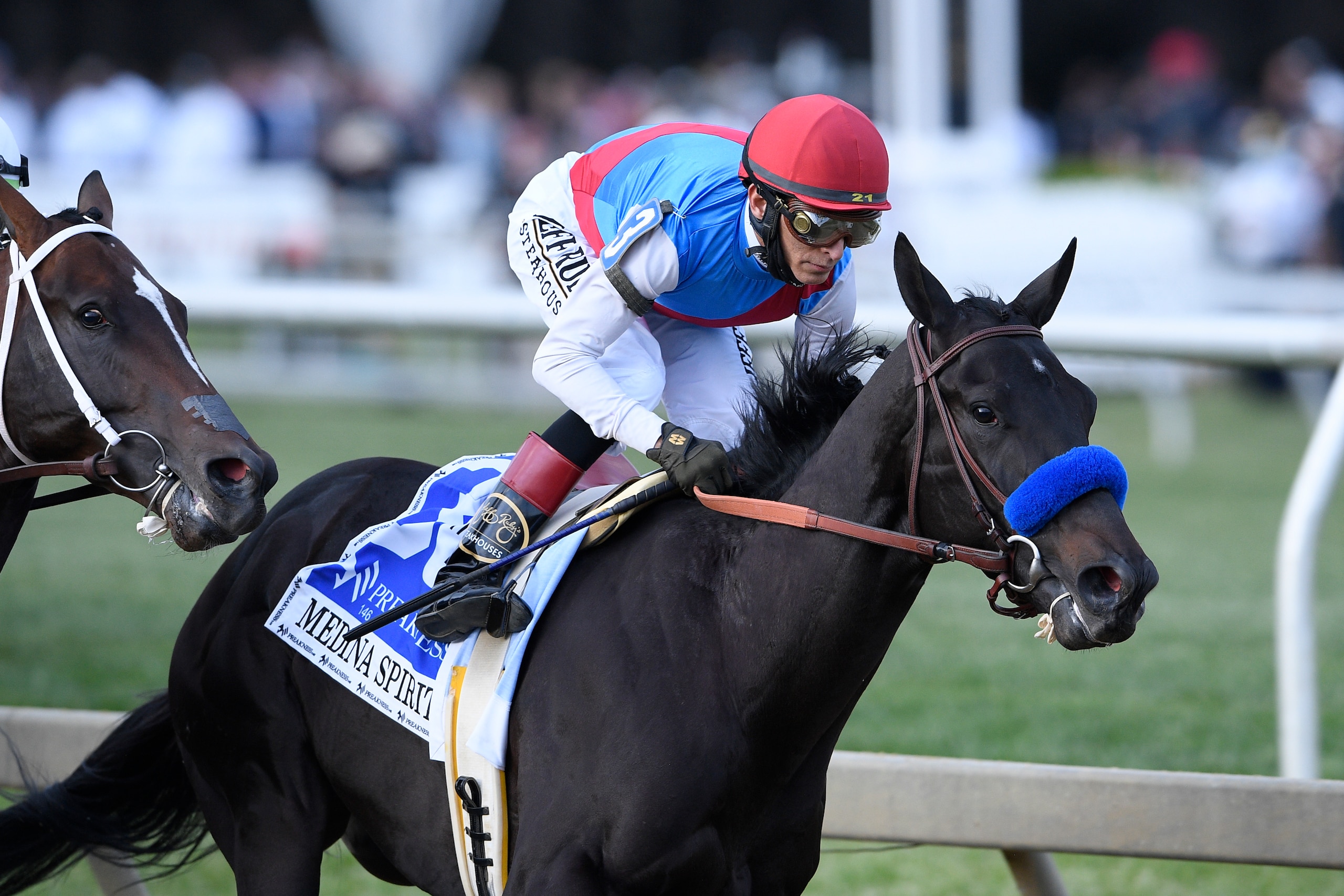 John Velazquez atop Medina Spirit runs in the Preakness Stakes horse race at Pimlico Race Course, Saturday, May 15, 2021, in Baltimore. (AP Photo/Nick Wass)