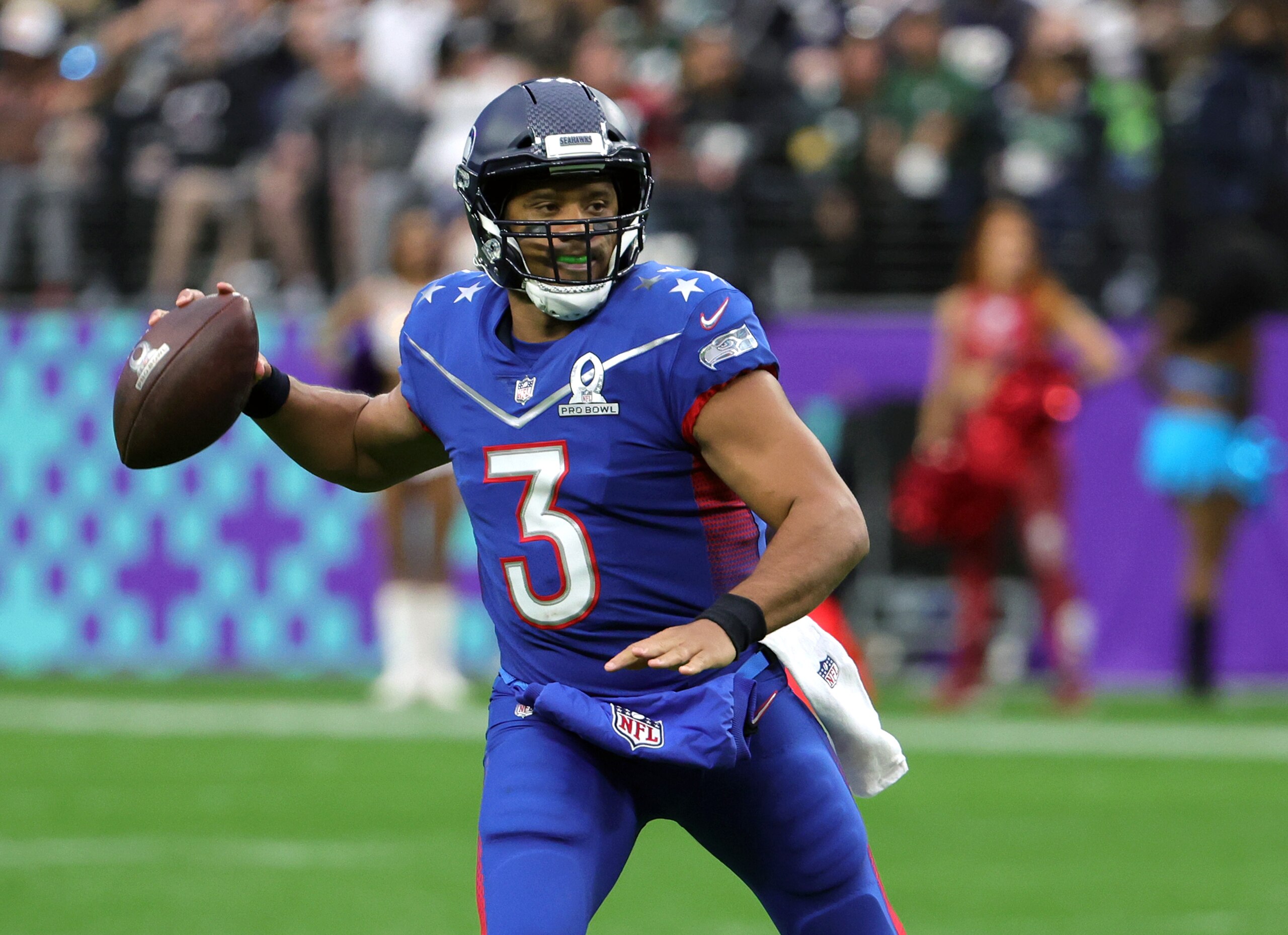 LAS VEGAS, NEVADA - FEBRUARY 06:  Russell Wilson #3 of the Seattle Seahawks and NFC looks to throw against the AFC during the 2022 NFL Pro Bowl at Allegiant Stadium on February 06, 2022 in Las Vegas, Nevada. The AFC defeated the NFC 41-35.  (Photo by Ethan Miller/Getty Images)