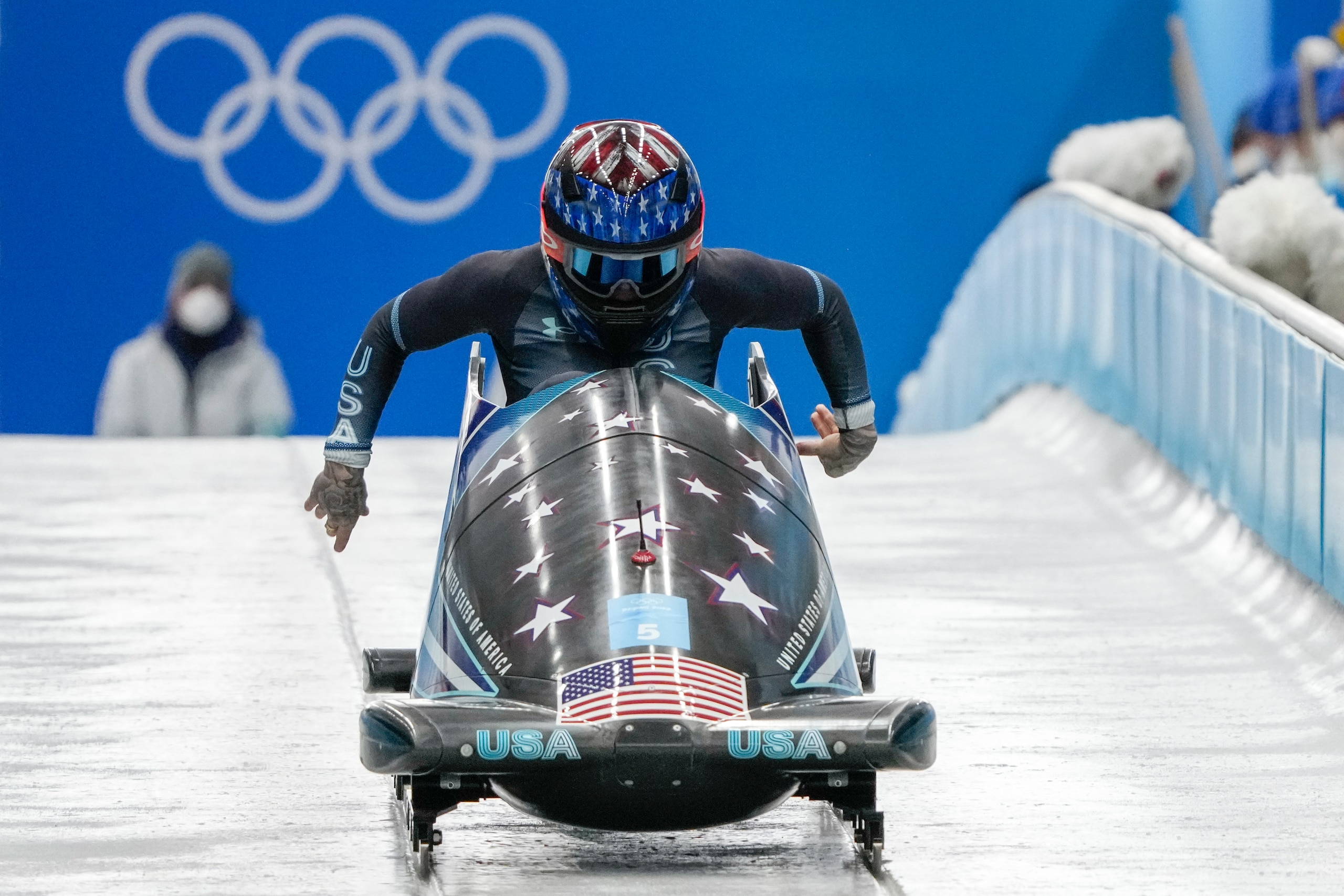 Kaillie Humphries, of the United States, drives during the women's monobob heat 3 at the 2022 Winter Olympics, Monday, Feb. 14, 2022, in the Yanqing district of Beijing. (AP Photo/Mark Schiefelbein)