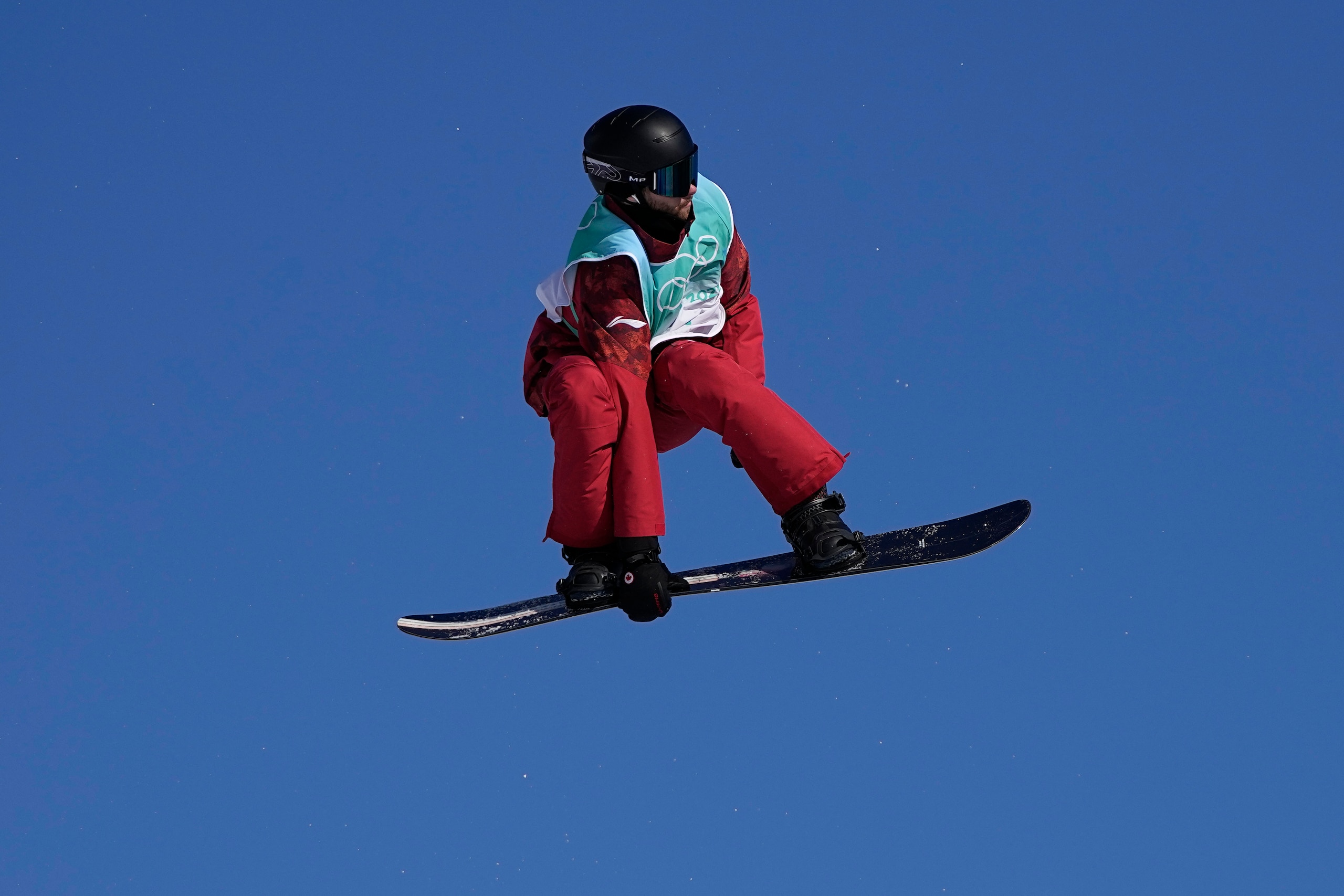 Max Parrot of Canada competes during the men's snowboard big air qualifications of the 2022 Winter Olympics, Monday, Feb. 14, 2022, in Beijing. (AP Photo/Jae C. Hong)