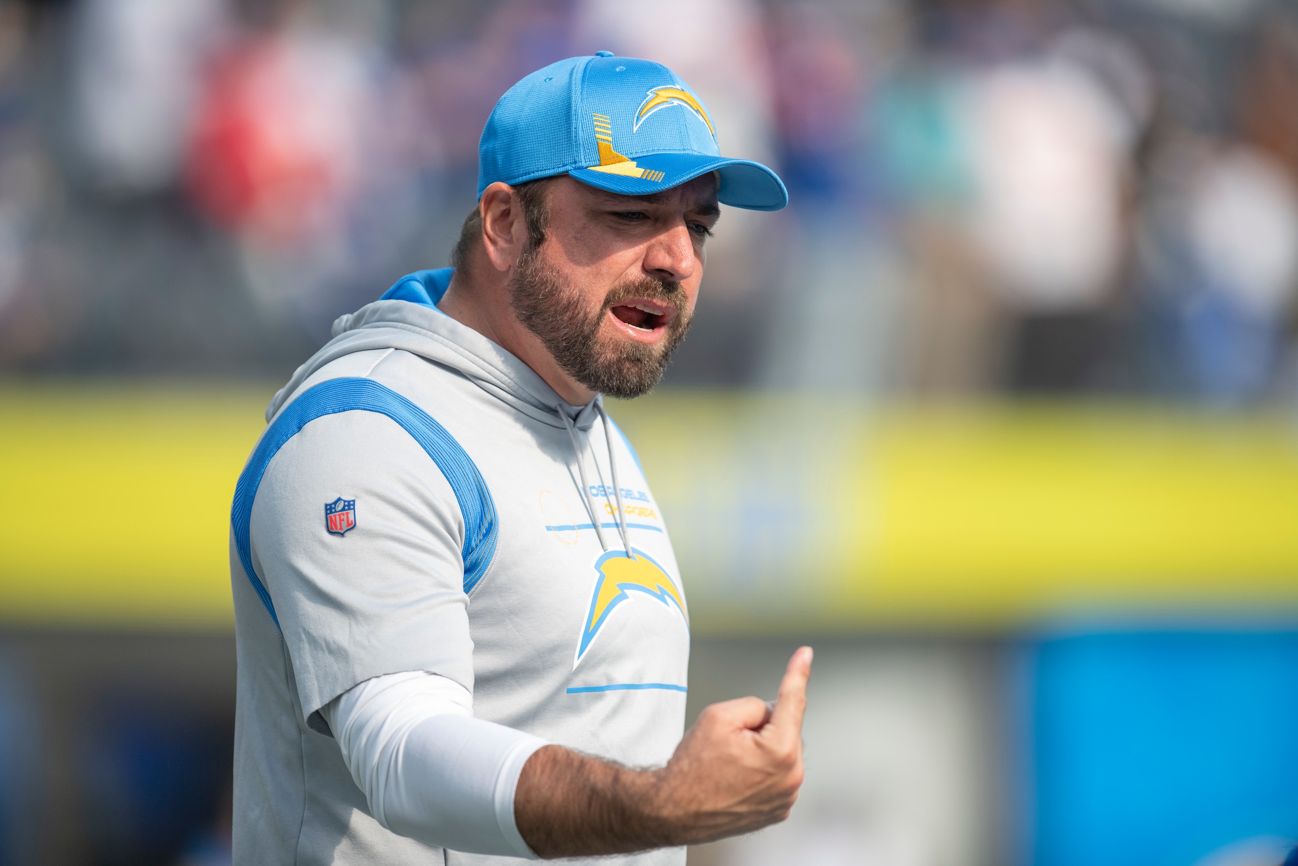 Los Angeles Chargers run game coordinator Frank Smith yells instructions to his players before an NFL football game against the New York Giants Sunday, Dec. 12, 2021, in Inglewood, Calif. (AP Photo/Kyusung Gong)