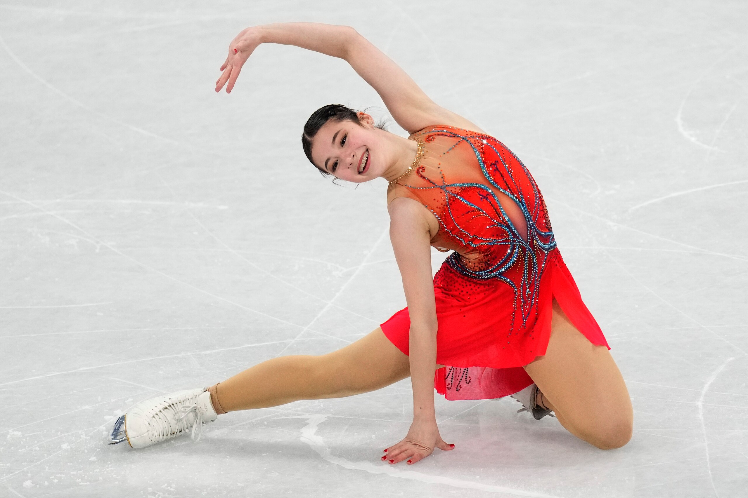 Alysa Liu, of the United States, competes in the women's short program during the figure skating at the 2022 Winter Olympics, Tuesday, Feb. 15, 2022, in Beijing. (AP Photo/Bernat Armangue)