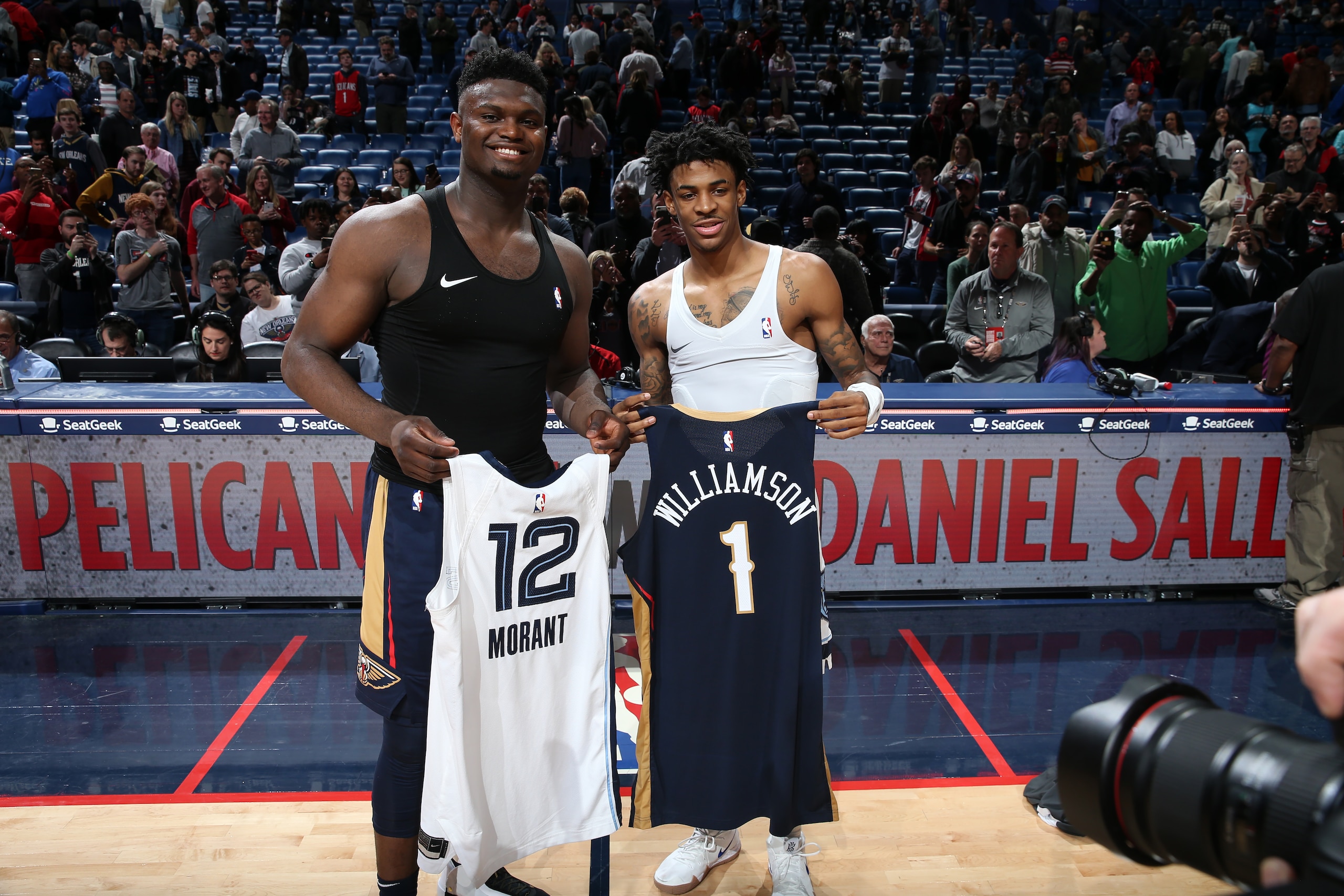 NEW ORLEANS, LA - JANUARY 31: Zion Williamson #1 of the New Orleans Pelicans and Ja Morant #12 of the Memphis Grizzlies swap jerseys after the game on January 31, 2020 at the Smoothie King Center in New Orleans, Louisiana. NOTE TO USER: User expressly acknowledges and agrees that, by downloading and or using this Photograph, user is consenting to the terms and conditions of the Getty Images License Agreement. Mandatory Copyright Notice: Copyright 2020 NBAE (Photo by Layne Murdoch Jr./NBAE via Getty Images)