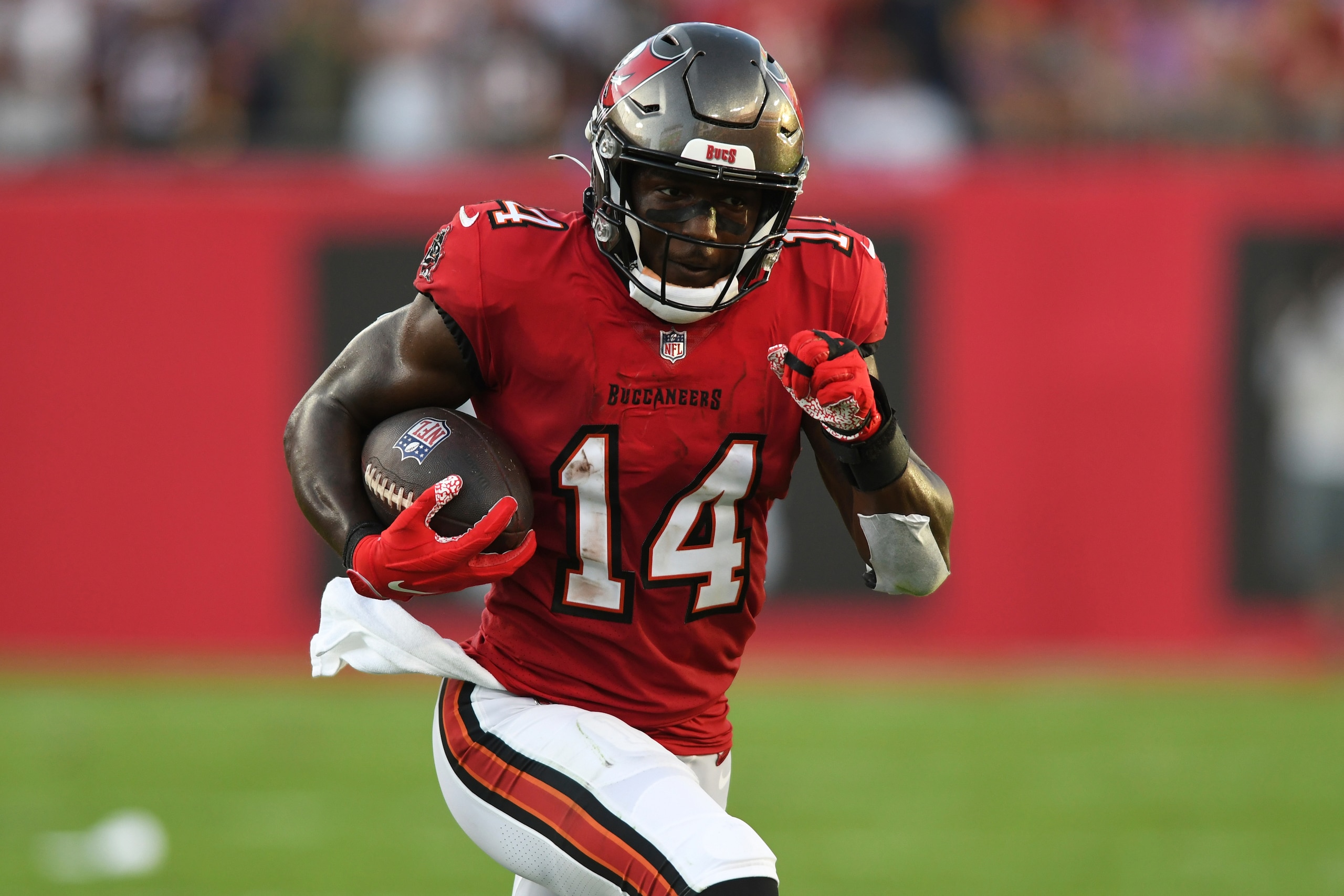 Tampa Bay Buccaneers wide receiver Chris Godwin (14) runs with the ball after a catch against the Buffalo Bills during the first half of an NFL football game Sunday, Dec. 12, 2021, in Tampa, Fla. (AP Photo/Jason Behnken)