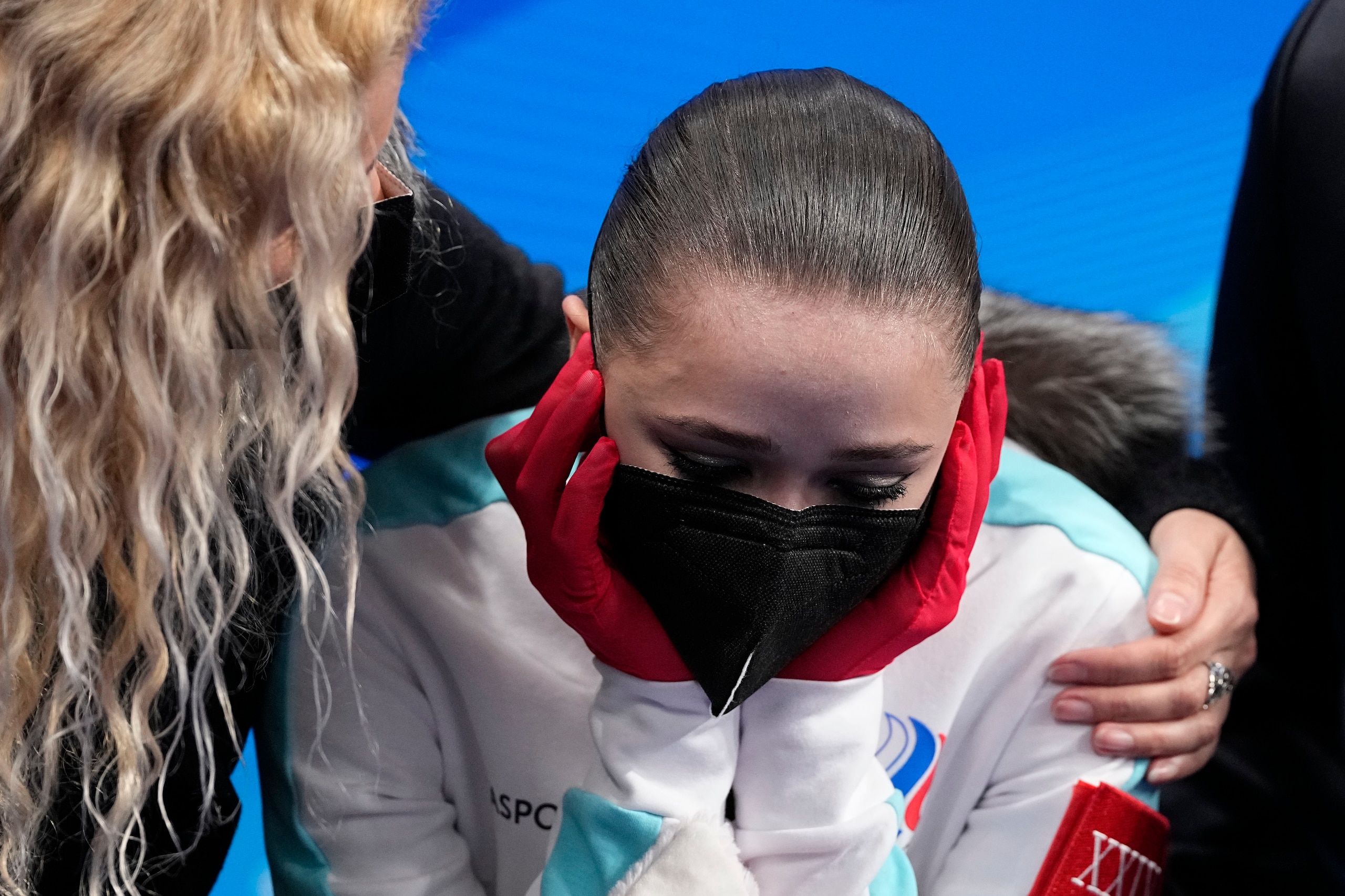 Kamila Valieva, of the Russian Olympic Committee, is embraced by her coach Eteri Tutberidze after competing in the women's free skate program during the figure skating competition at the 2022 Winter Olympics, Thursday, Feb. 17, 2022, in Beijing. (AP Photo/David J. Phillip)