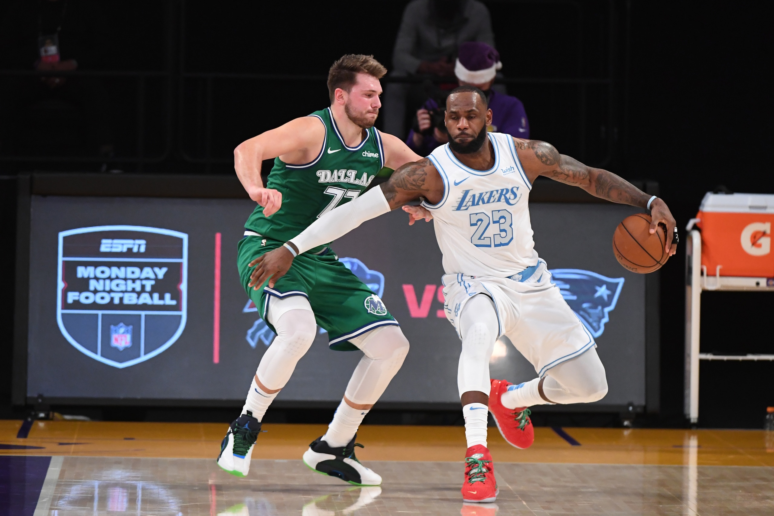 LOS ANGELES, CA - DECEMBER 25: LeBron James #23 of the Los Angeles Lakers handles the ball against Luka Doncic #77 of the Dallas Mavericks during the game on December 25, 2020 at STAPLES Center in Los Angeles, California. NOTE TO USER: User expressly acknowledges and agrees that, by downloading and/or using this Photograph, user is consenting to the terms and conditions of the Getty Images License Agreement. Mandatory Copyright Notice: Copyright 2020 NBAE (Photo by Adam Pantozzi/NBAE via Getty Images)