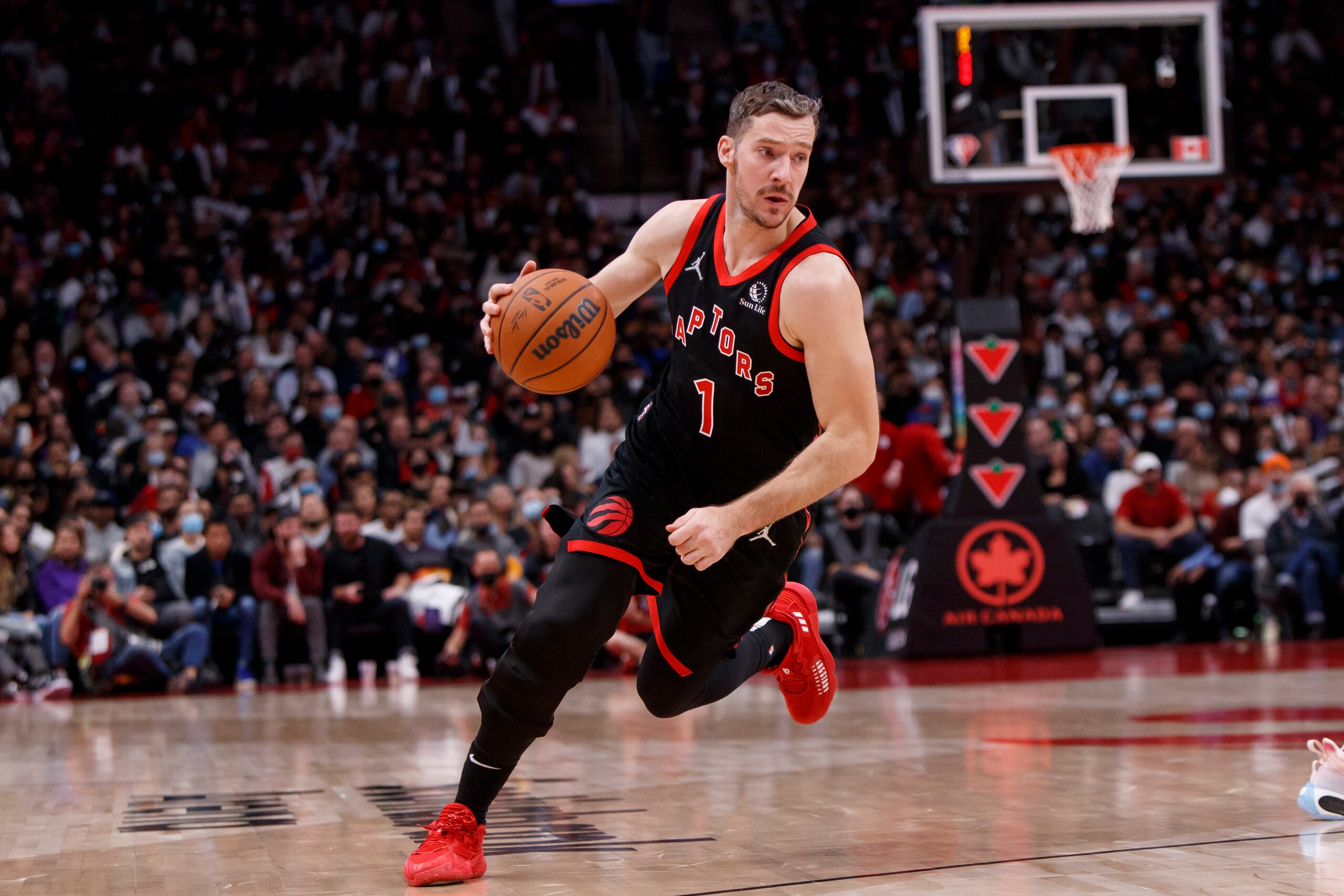 TORONTO, ON - OCTOBER 23: Goran Dragic #1 of the Toronto Raptors dribbles up court during the second half of their NBA game against the Dallas Mavericks at Scotiabank Arena on October 23, 2021 in Toronto, Canada. NOTE TO USER: User expressly acknowledges and agrees that, by downloading and or using this Photograph, user is consenting to the terms and conditions of the Getty Images License Agreement. (Photo by Cole Burston/Getty Images)