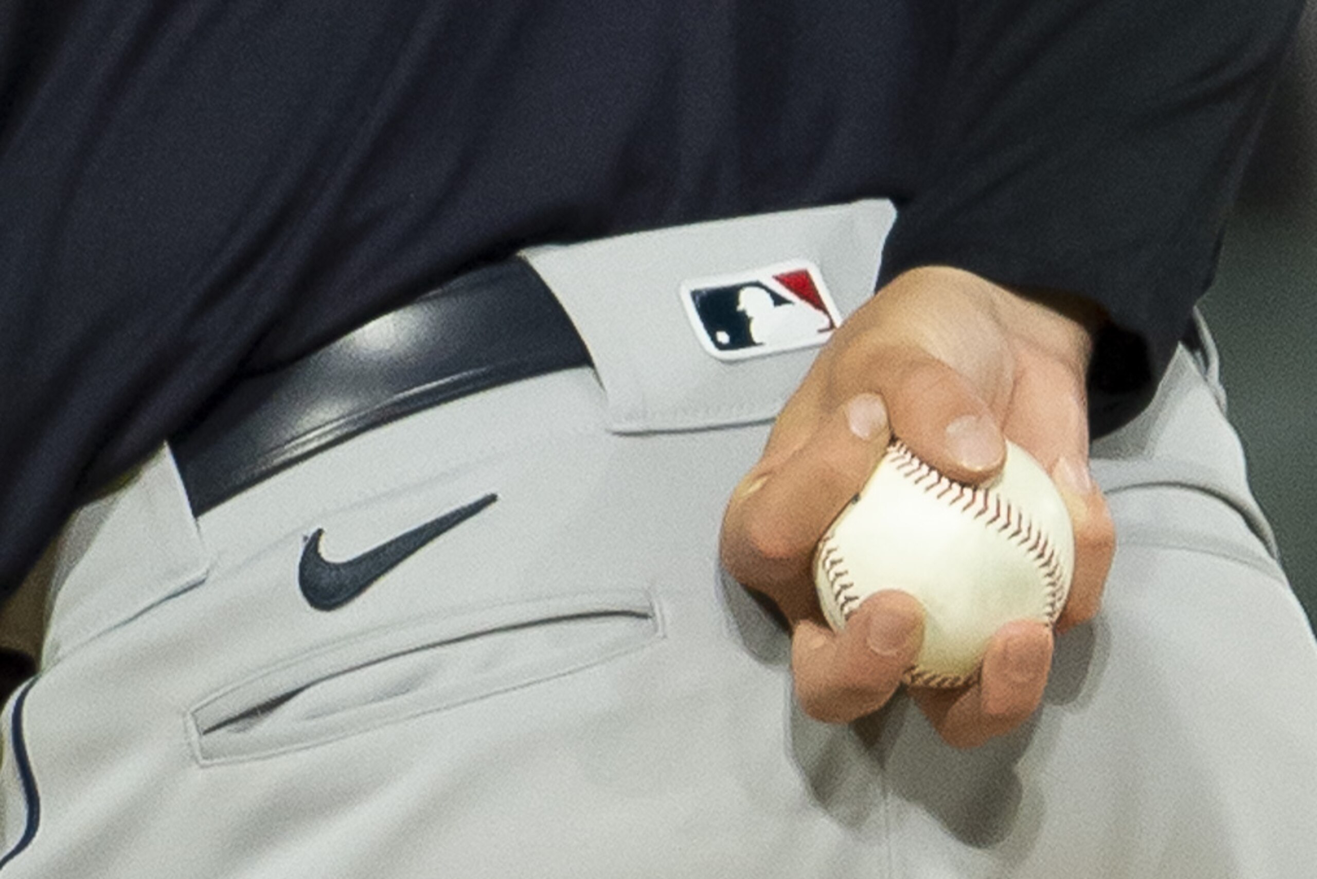 CHICAGO - APRIL 12: A closeup detailed view of a pitchers grip on a baseball as held by Cal Quantril #47 while in the stretch during the game between the Cleveland Indians and Chicago White Sox on April 12, 2021 at Guaranteed Rate Field in Chicago, Illinois. (Photo by Ron Vesely/Getty Images) CHICAGO - APRIL 12: A closeup detailed view of a pitchers grip on a baseball as held by Cal Quantril #47 while in the stretch during the game between the Cleveland Indians and Chicago White Sox on April 12, 2021 at Guaranteed Rate Field in Chicago, Illinois. (Photo by Ron Vesely/Getty Images)