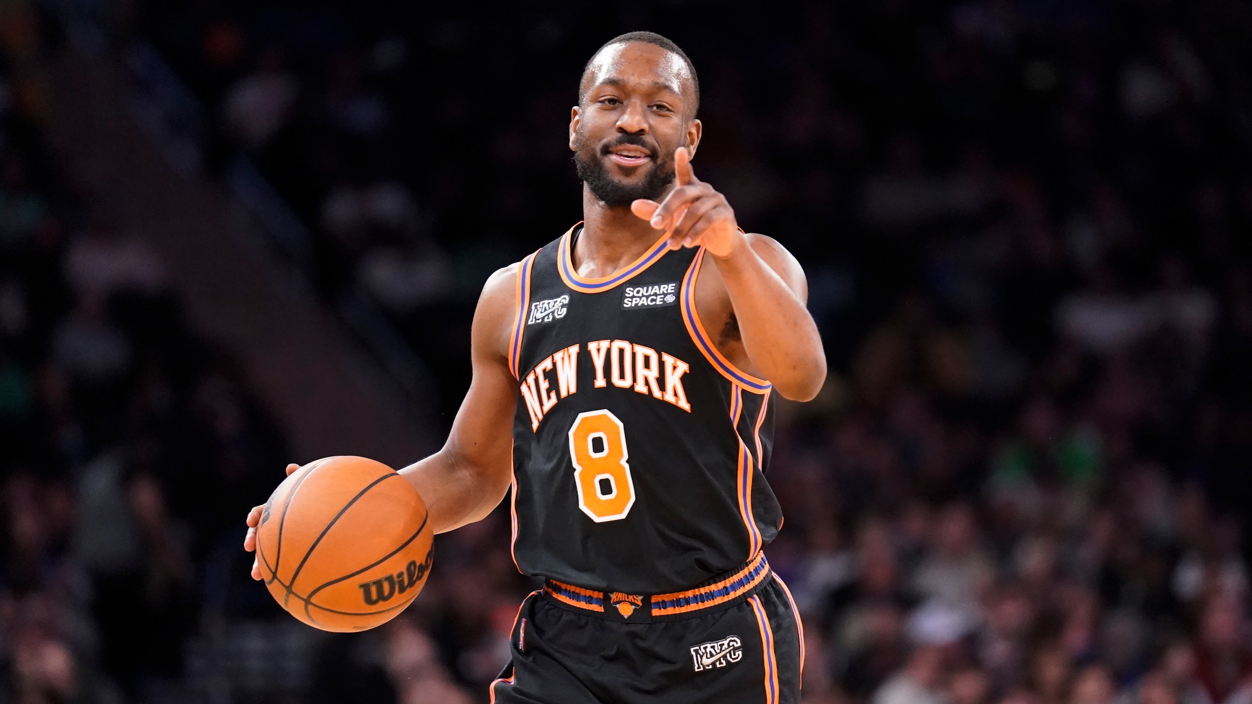 New York Knicks guard Kemba Walker (8) dribbles up the court during the second half of an NBA basketball game against the Brooklyn Nets, Wednesday, Feb. 16, 2022, in New York. (AP Photo/John Minchillo)