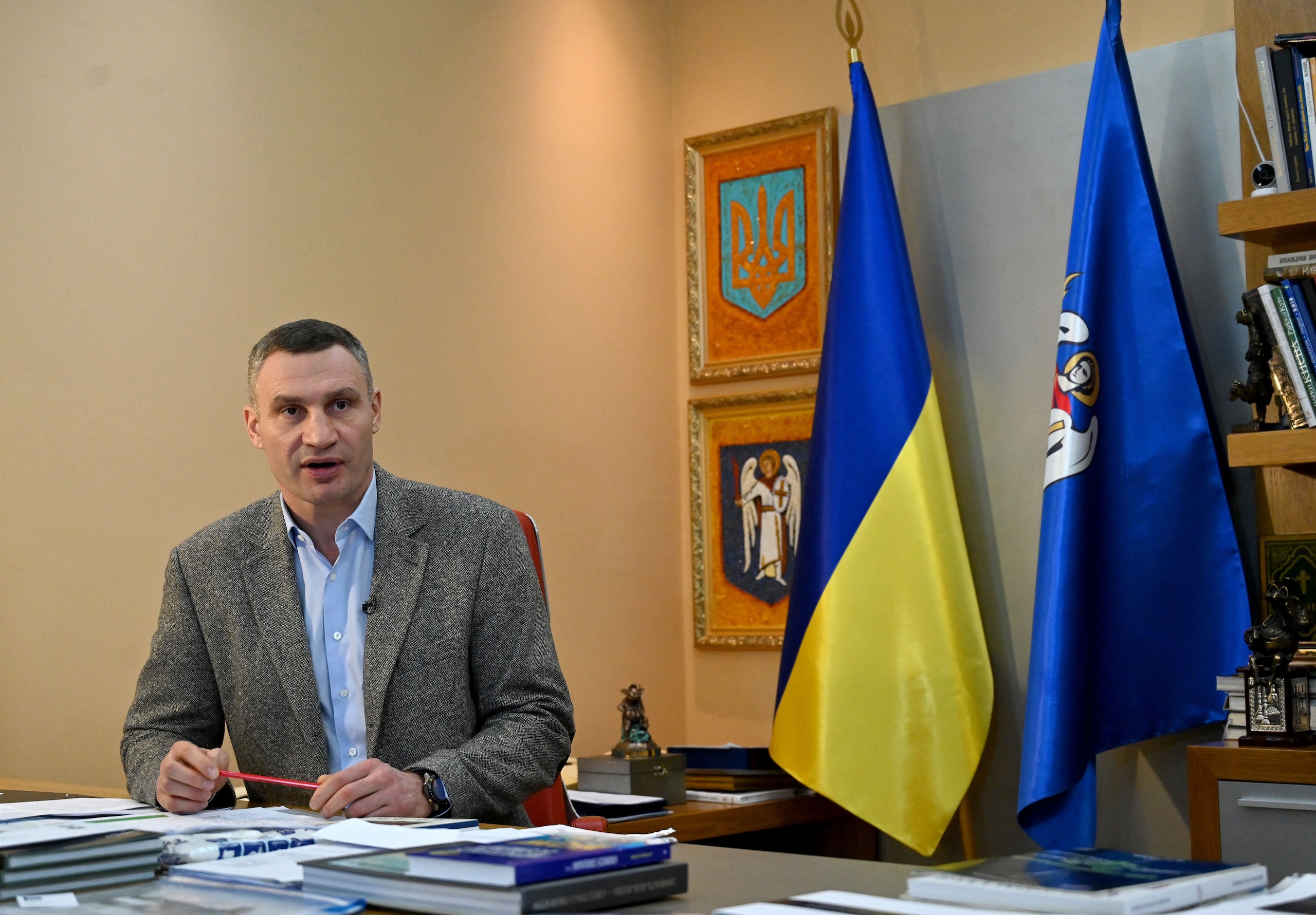 Heavyweight boxing champion, turned Kyiv mayor Vitali Klitschko, talks to AFP journalists at his office in Kyiv on February 10, 2022. - Vitali Klitschko said he was ready "to take up arms" defending Ukraine against a feared Russian invasion and the ex-boxer in category of the heavy weights who lived a long time and trained in Germany and where he remains a celebrity, reproached his host country to block the deliveries of weapons to Ukraine at the critical moment. (Photo by Sergei SUPINSKY / AFP) (Photo by SERGEI SUPINSKY/AFP via Getty Images)