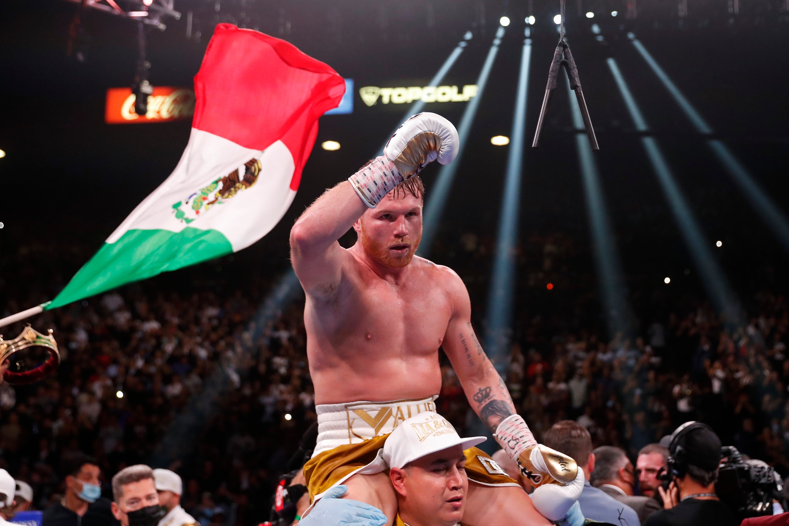 Canelo Alvarez, of Mexico, celebrates after defeating Caleb Plant by TKO in a super middleweight title unification fight Saturday, Nov. 6, 2021, in Las Vegas. (AP Photo/Steve Marcus)