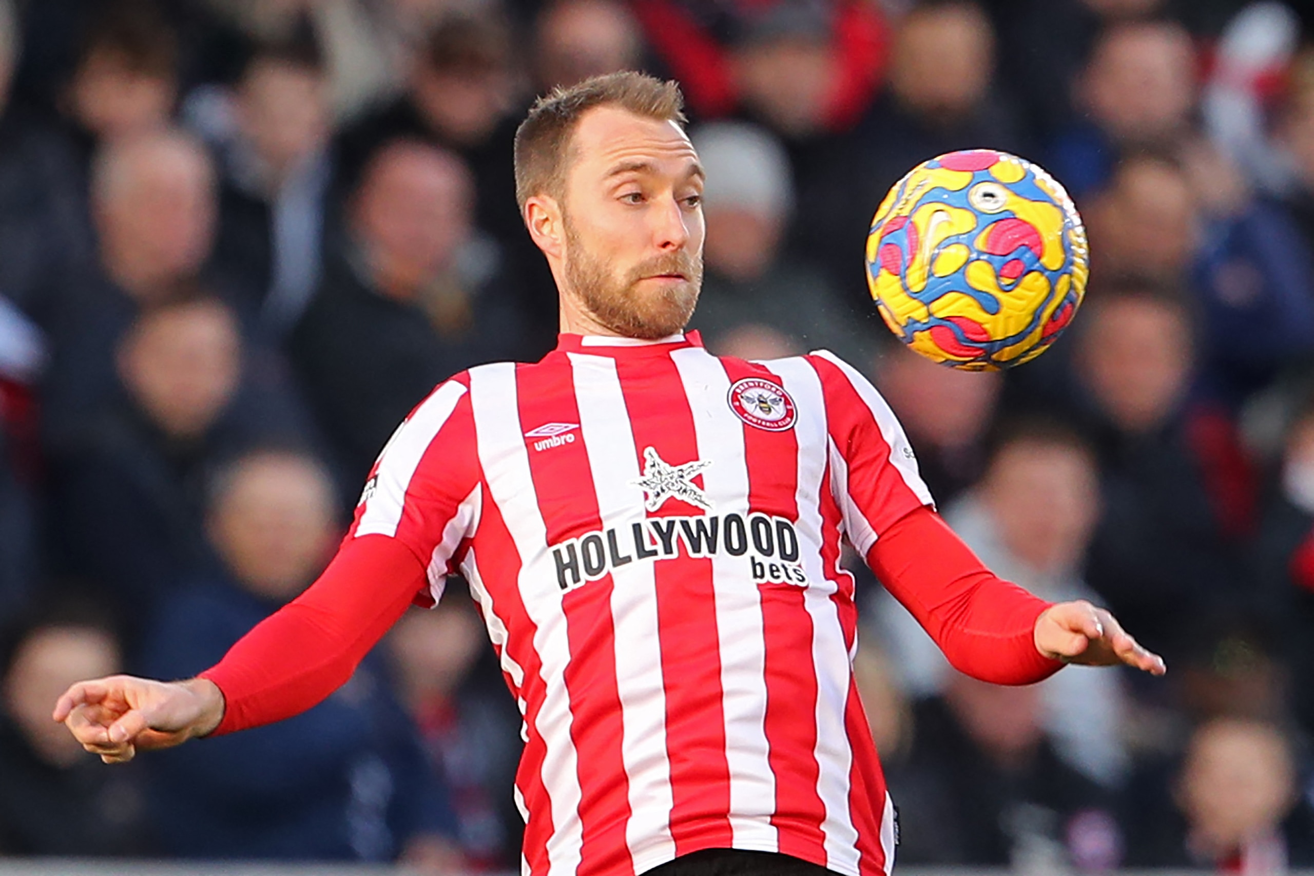 Brentford's Danish midfielder Christian Eriksen controls the ball during the English Premier League football match between Brentford and Newcastle United at Brentford Community Stadium in London on February 26, 2022. - Christian Eriksen was named among the Brentford substitutes for the visit of Newcastle in the Premier League on Saturday. The former Tottenham and Inter Milan midfielder is set for an emotional return to football eight months after suffering a cardiac arrest on the pitch during Denmark's Euro 2020 match against Finland.
 - RESTRICTED TO EDITORIAL USE. No use with unauthorized audio, video, data, fixture lists, club/league logos or 'live' services. Online in-match use limited to 120 images. An additional 40 images may be used in extra time. No video emulation. Social media in-match use limited to 120 images. An additional 40 images may be used in extra time. No use in betting publications, games or single club/league/player publications. (Photo by Geoff Caddick / AFP) / RESTRICTED TO EDITORIAL USE. No use with unauthorized audio, video, data, fixture lists, club/league logos or 'live' services. Online in-match use limited to 120 images. An additional 40 images may be used in extra time. No video emulation. Social media in-match use limited to 120 images. An additional 40 images may be used in extra time. No use in betting publications, games or single club/league/player publications. / RESTRICTED TO EDITORIAL USE. No use with unauthorized audio, video, data, fixture lists, club/league logos or 'live' services. Online in-match use limited to 120 images. An additional 40 images may be used in extra time. No video emulation. Social media in-match use limited to 120 images. An additional 40 images may be used in extra time. No use in betting publications, games or single club/league/player publications. (Photo by GEOFF CADDICK/AFP via Getty Images)