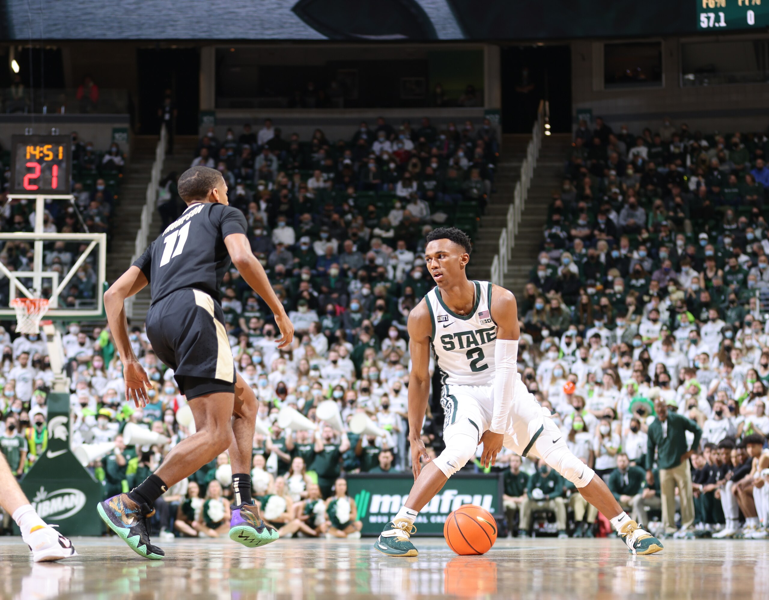 EAST LANSING, MI - FEBRUARY 26: Tyson Walker #2 of the Michigan State Spartans handles the ball under pressure from Isaiah Thompson #11 of the Purdue Boilermakers in the first half of the game at Breslin Center on February 26, 2022 in East Lansing, Michigan. (Photo by Rey Del Rio/Getty Images)